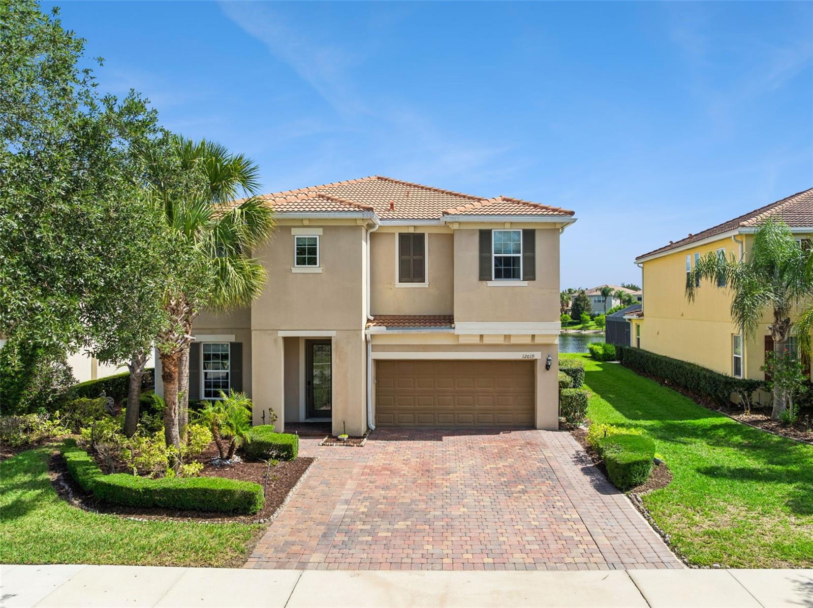 One or more photo(s) has been virtually staged. MODEL-PERFECT & MOVE-IN READY in VillageWalk at Lake Nona! Situated on one of VillageWalk’s premium waterfront homesites, this stunning Pulte-built Savona floor plan offers the perfect blend of luxury, comfort, and resort-style living. Featuring 4 bedrooms, 4 full bathrooms, a private office, formal dining room, spacious upstairs bonus room, 8-foot doors throughout, and an incredible custom screened lanai, this home is loaded with upgrades and designed to impress even the most discerning buyer. Notable enhancements include approximately $25,000 in custom cabinetry and storage solutions, including upgraded garage storage, along with a $7,000 Bose built-in audio system, adding both functionality and entertainment value. Freshly painted throughout and featuring brand-new carpeting in all bedrooms, the bright and open floor plan welcomes you the moment you enter.  The private office is conveniently located off the foyer, while the formal dining room provides an elegant space for entertaining family and guests. At the heart of the home is the fully upgraded gourmet kitchen, showcasing 42-inch cabinetry with crown molding, decorative hardware, granite countertops, tile backsplash, upgraded appliances, breakfast bar, walk-in pantry, glass display cabinets, and a built-in wine rack. The kitchen seamlessly connects to the breakfast nook and expansive family room with recessed lighting, creating a warm and inviting gathering space. Step through the sliding glass doors and discover the true highlight of this exceptional property, a spectacular custom screened lanai valued at approximately $60,000, overlooking serene water views and offering the ultimate outdoor living experience. The first floor also features a guest bedroom and full bathroom, ideal for visitors or multi-generational living. Upstairs, the oversized bonus room provides endless flexibility for a media room, game room, playroom, or additional entertainment space. The luxurious owner’s suite features a tray ceiling, breathtaking water views, and dual custom walk-in closets with built-in organizers. One secondary bedroom includes a private en-suite bathroom, while an additional full bathroom serves the remaining bedroom and bonus room area.  Located just minutes from Lake Nona Medical City, Orlando International Airport, major highways, shopping, dining, and top-rated schools, VillageWalk offers an unmatched lifestyle in one of Orlando’s most sought-after communities. The community’s 26,000-square-foot Town Center features a clubhouse with gathering and multipurpose spaces, catering kitchen, covered lanais, state-of-the-art fitness center with updated equipment, resort-style swimming pool, lap pool, six clay tennis courts, basketball court, playground, full-time activities director, on-site deli, gas station, and miles of scenic walking and biking paths. The HOA includes complete lawn and exterior ground maintenance, providing true maintenance-free resort-style living within a 24-hour guard-gated community.  This exceptional waterfront home perfectly combines luxury, location, and lifestyle. Don’t miss this rare opportunity to own one of VillageWalk’s most desirable properties. Schedule your private showing today and experience everything VillageWalk at Lake Nona has to offer! PRICED TO SELL!