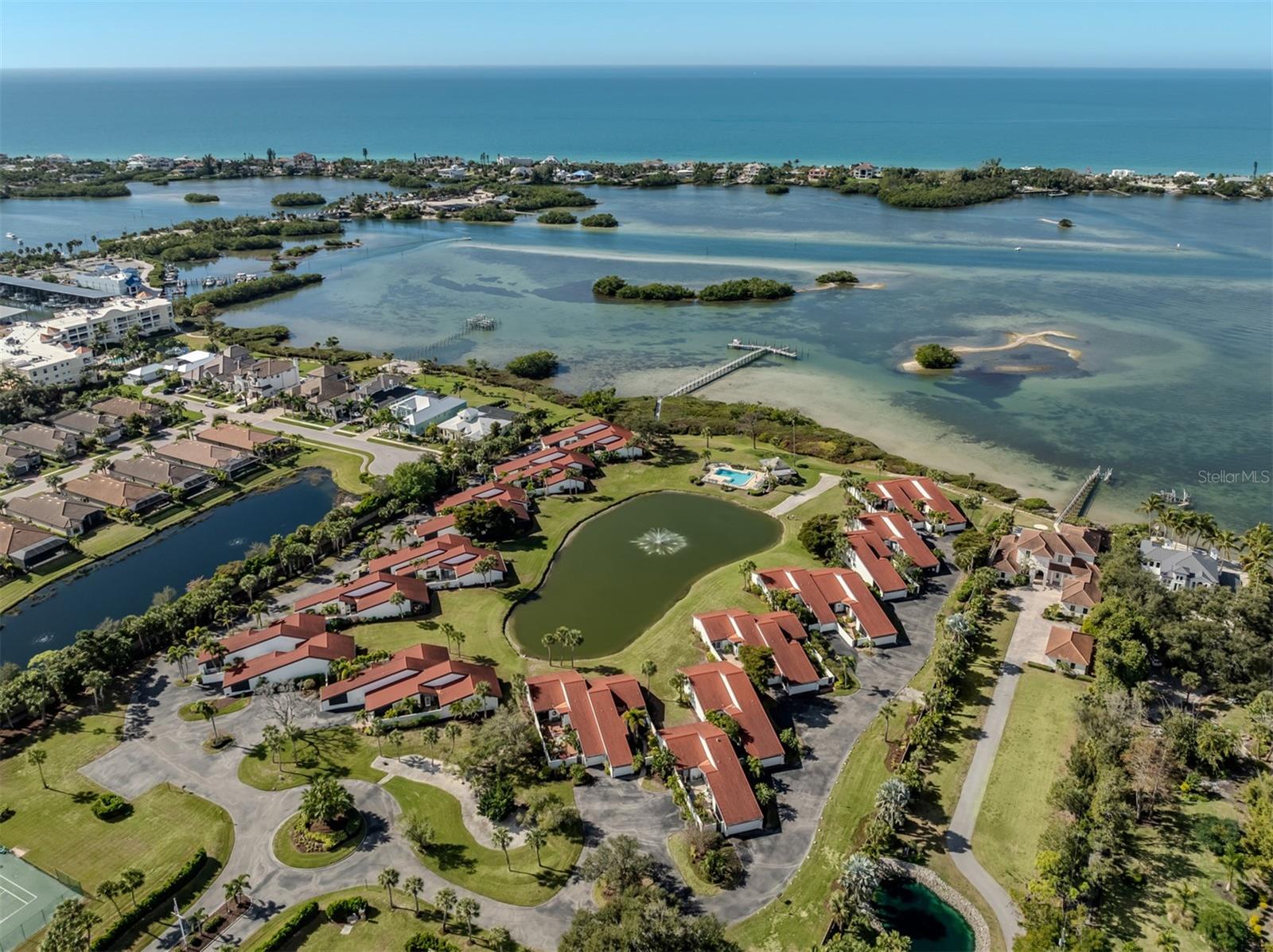 Boat Slips included, Insurance included, Ground maintenance included!!Secluded waterfront community on Little Sarasota Bay with access to the Intracoastal Waterway and the Gulf. Heron Bay Club has boat slips available! This small community on Little Sarasota Bay offers striking sunsets. Across from the northern section of Casey Key, the 10-acre property features 26 villas. This complex is intimate, quiet and peaceful. Part of the reason for the relaxing atmosphere is that Heron Bay Club lies off the beaten track. All villas have a courtyard entry, which creates a big, sheltered outdoor living area. This home has unmatched waterfront views from most rooms. 786 Sarabay has been updated and is move-in ready. The HOA fee covers all the community amenities which include a new Trex deck dock for your boat, a fishing pier and fish cleaning station, kayak and paddle board launches, a heated swimming pool, a tiki hut to enjoy sunsets, tennis courts along with maintenance-free grounds. Also included in the HOA fee is water, cable, internet along with insurance and roofs. You will not find another villa with as much storage as this unit due to the attached two-car garage. This villa is a short distance to all Sarasota has to offer such as beaches, the arts and shopping. Visit Heron Bay Club and make it your new home!
