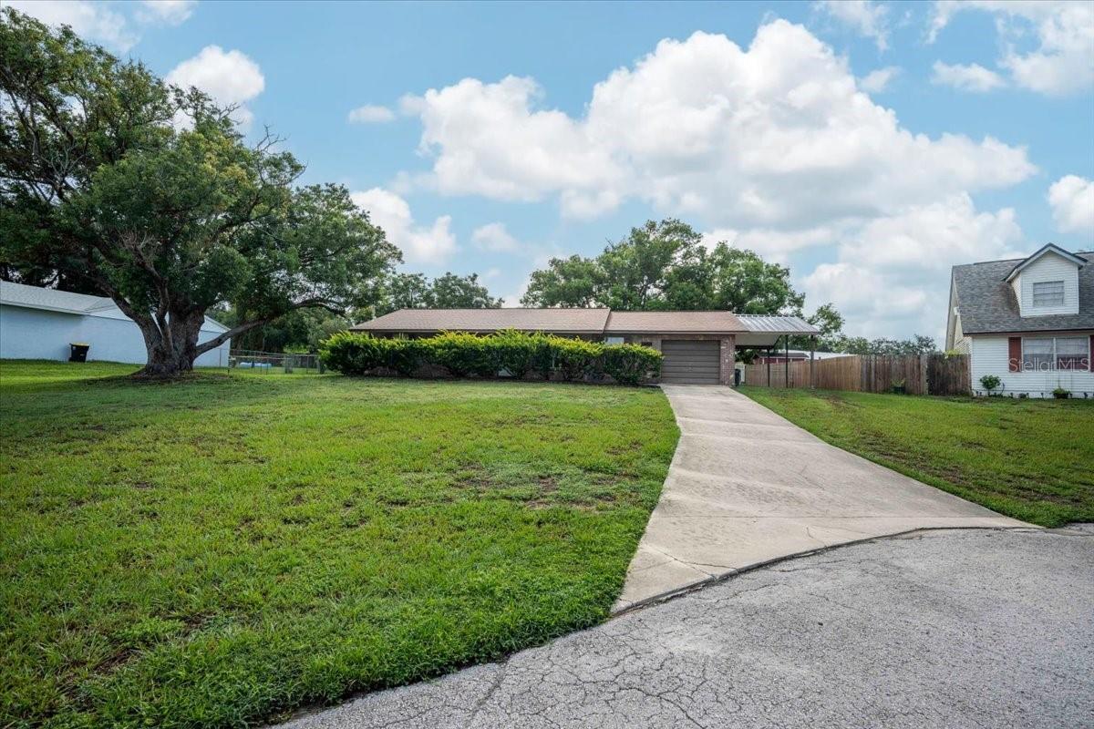 Retro Midcentury Charm Meets Modern Potential! Step back in time to 1976 with this captivating single-family residence, showcasing authentic retro mid-century design elements ready to be celebrated or creatively reimagined! Located in North Lakeland, this property is a rare find for vintage enthusiasts, creative buyers, and investors looking for a home with true architectural character. Showcasing authentic 1970s character, this home features classic architectural lines and unique vintage materials. Retro flooring throughout, features signature period flooring, including vintage linoleum/vinyl and classic carpeting. The solid masonry construction paired with a distinct shake/shingle style roof line. This home also offers 3 spacious bedrooms and 2.0 full bathrooms, providing a fantastic canvas for your design ideas. Situated on an oversized 0.30-acre lot with a sprawling backyard, perfect for a vintage-style patio or garden. Ample parking, as there is a garage and carport setup, offering excellent storage for projects or classic vehicles. No HOA and no CDD. Schedule your private tour today!