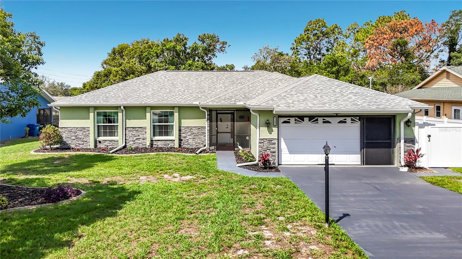 Come & see this well-cared-for home in a peaceful Spring Hill neighborhood with no HOA fees or restrictions. Many upgrades including: Roof 2022, windows & doors 2022, vinyl fence 2025, A/C 2019. Home features a screened garage and front entryway, vaulted ceilings, a living and dining room combo, and tile flooring throughout. The kitchen was completely remodeled a few years ago. With beautiful wood soft-close cabinets, 3-tier granite countertops, under-counter lighting, a pantry, and stainless steel appliances with a pass-through counter to the dining room. The master bedroom is generously sized with plenty of closet space; the master bath has a dual sink vanity and a large walk-in shower. The guest bathroom has a tub/shower combo. Both bathrooms have new vanities with the same 3-tier granite as the kitchen, with soft-close cabinets. There are Lovely French doors in the living room and new glass sliding doors in the kitchen open to the pool area. New brick pavers make for an excellent spot to catch some rays. And the newly refinished in-ground pool is also heated, so you can swim to your heart’s content year-round! This home is in an ideal location. There are 4 local parks, all of which fall within a 5-mile radius: Rotary Centennial Dog Park, Delta Woods Park, Weeki Wachee Springs State Park, and Veterans Memorial Park. You’re also within 3 miles of Spring Hill Elementary, Explorer K-8, and Springstead High School. There are tons of shopping and dining options nearby. Popular swimming destinations like Roger’s Park and Pine Island Beach are only a short drive west. US-19 isn’t far, so Homosassa, Tarpon Springs, and Clearwater are all easily accessible. An entrance to the Suncoast Parkway is a few minutes east, so Tampa and the international airport are all also a convenient trip away. Don’t miss your chance to own a piece of the American dream - make your appointment to view this one today!