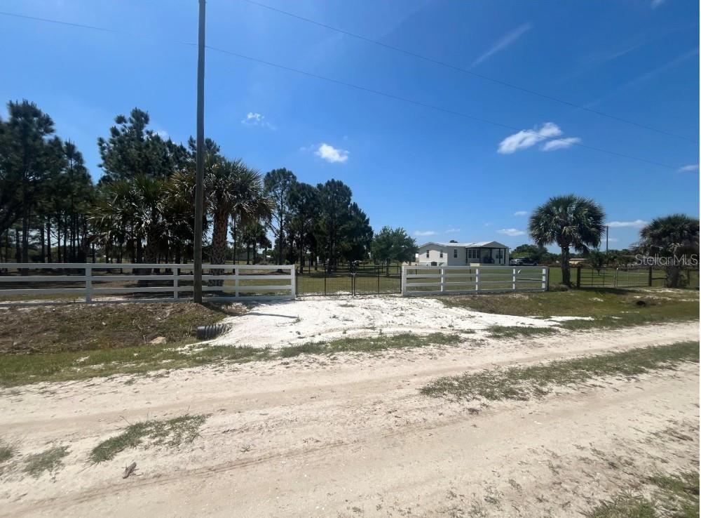 Price Negotiable - Beautiful property that is completely fenced in and comes with a new shed. Build or bring your dream home and barn on this beautiful 1.25 acre just off of the main paved road but yet still private. The well has been dug so this will save you some time. This lot which boasts a circular driveway, dual entrances, and complete fencing, privacy and accessibility are perfectly balanced. Okeechobee County offers a unique blend of tranquility and adventure for those looking bring their dream home to life. For nature and sports enthusiasts, the nearby Kissimmee River Preserve State Park and the flowing Kissimmee River into Lake Okeechobee present endless opportunities for fishing, hunting, and exploring the great outdoors. Okeechobee County is not just a place to reside; it's a lifestyle choice that caters to a variety of interests and activities, all while offering the peace and privacy desired by many. Well is near the shed