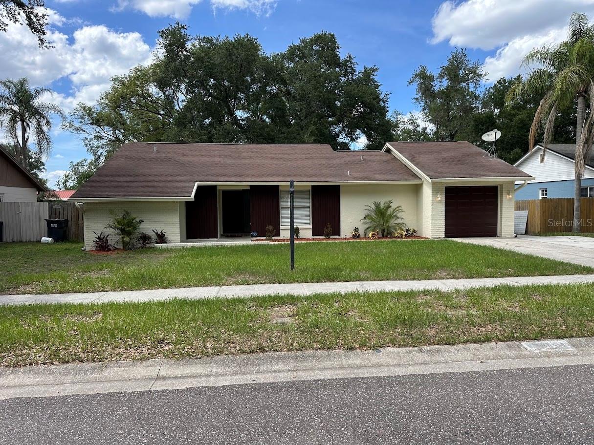 New on the market, and at this price, won't last long!  Come see this amazing updated home located in a high demand subdivision before someone else is calling this home.  This 3 bedroom 2 bathroom 1 car garage home features a large great room with a woodburning fireplace, track lighting, ceiling fan and French doors. The large covered and screened porch is great to relax and view your large fenced in back yard. Updates include: Freshly painted interior and exterior including the garage floor, trim molding around the fireplace, hurricane garage door, & newly serviced HVAC system. The large driveway can hold at least 4 cars.