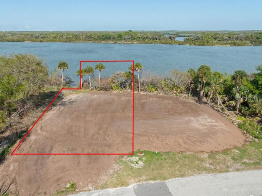 What a view! Direct Intracoastal. This wide section of the River/ Intracoastal Waterway is gorgeous, looking east you see the backwater and islands across the waterway. Come watch the dolphins and manatees swim by as you relax on your back porch or jump on your boat for a day of fishing, shrimping or site seeing. Build your custom home and dock here, see the AI generated model homes in the photos. There are 2 lots available so there is the option of purchasing both. Come enjoy the all of the nature and beauty that SE Volusia county has to offer. You have a front row seat to the weekly launches from Cape Canavel. This location is a 15 minute drive to the Arts and Entertainment district in New Smyrna Beach and about the same to the beach! Less than an hour to the Orlando airport and attractions. Come take a look. The model homes in the photos are AI generated. The adjacent lot is also available 185 Jones Fish Camp Rd, MLS # NS1087816