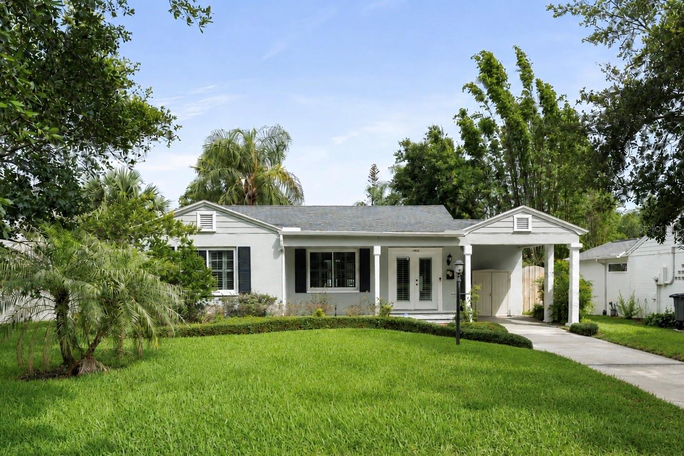 Virtually Staged. Located in the heart of Orwin Manor, one of Winter Park’s most beloved historic neighborhoods, 1521 Cavendish Road is a beautifully renovated 2-bedroom, 1-bath home offering 1,042 square feet of thoughtfully updated living space. Positioned between Winter Park, College Park, and Downtown Orlando, residents enjoy convenient access to AdventHealth, Loch Haven Park, the Orlando Museum of Art, Orlando Science Center, Park Avenue, Ivanhoe Village, and some of the area's most celebrated dining, shopping, and cultural destinations. Surrounded by mature landscaping, manicured hedges, colorful garden beds, and stately palms, the home's curb appeal reflects the character and pride of ownership found throughout the neighborhood. French front doors open to a spacious foyer that leads into a bright family and dining room combination, where new pine laminate flooring, crown molding, plantation shutters, and updated lighting blend historic character with modern comfort. The renovated kitchen features shaker cabinetry, Silestone countertops, stainless steel appliances, abundant storage, and natural light. Both bedrooms have been thoughtfully updated with new flooring, LED recessed lighting, ceiling fans, and plantation shutters, while the recently renovated bathroom pairs basketweave tile flooring, subway tile, quartz countertops, and classic finishes that honor the home's original style. Outside, the large backyard has been transformed into a private retreat featuring a composite deck, new fencing, mature palms, raised garden beds, steel-edged landscaping, and a paver walkway. Thoughtfully updated while preserving its architectural charm, this home offers a rare opportunity to enjoy historic character in a neighborhood that continues to benefit from the growth, investment, and enduring appeal of Winter Park and Downtown Orlando. Schedule your private tour today.