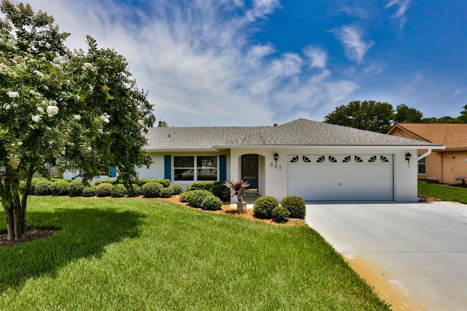 Welcome to your new home in the coveted neighborhood of Meadow Lakes.  This home is flooded with natural light and an open and airy feel.  Vaulted ceilings as you enter make for a large living space that opens to the kitchen.  You will have plenty of room for the whole family in over 1600 sqft 3 bedroom and 2 bath split plan layout.  You will love cooking in this large open kitchen with gas range, dishwasher and french door refrigerator.  Loads of cabinet space to store all your dishes and appliances.  Eat at the breakfast bar or enjoy your coffee looking out the bay window onto your beautiful back yard.  You will immediately notice the pride of ownership in the landscaping with fruit trees and manicured hedges.  The back yard is fenced in and has plenty of room to add a pool if you like.  Save on your energy bill with Gas Dryer and Hot water heater as well as a pump and well for irrigation.  Oversized 24 x 24 porcelain tile though out the home with details that match to kitchen backsplash.  Relax in your large master bedroom with plenty of room for a king bed, night stands, dresser and more.  His and hers closets and attached bathroom.  The kids rooms are on the other side of the house and offer lots of space and another bath with tub and updated solid surface vanity.  2 car garage and extra parking area out front.  Furnishings are negotiable.  Walk to the new Whistle Stop park with lots of activities for everyone.  Shopping just a couple of blocks away at in the shopping center with Publix, Ace Hardware and restaurants.  Easy access to 95 and the beach is only 15 minutes away.  Isn't it time you started "Living the Dream" today!! ;Water: City