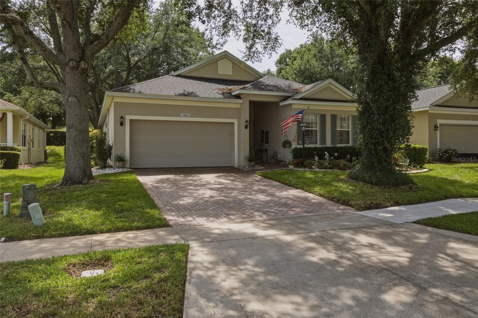 Welcome to your new home in the highly sought after golf course community of Summit Greens. Here you'll be close to everything you need: shopping, restaurants, entertainment, medical, recreation, educational, and easy access to major roadways. Ride your golf cart to the spacious clubhouse where you can visit with neighbors, participate in community-wide events, exercise in the state-of-the-art fitness center, and play tennis, pickleball, shuffleboard, bocce, billiards, cards and games, or swim in the heated community pool. In addition, the HOA includes a 24-hour guard staffed gate, all amenities, full yard maintenance, and cable TV and high-speed internet provided in the dues. Clermont National golf course, a driving range, mini golf course, The View restaurant and bar, and quick access to the South Lake Trail complement your new lifestyle in this highly desired community tucked away in the rolling hills of Clermont – you'll just love your new gem of the hills! This beautiful 2 bedroom, 2 bathroom home, with a bonus/flex room that can be utilized as a den, office, or third bedroom, has been loved and well-maintained by the original owner. FIRST TIME EVER ON THE MARKET! The primary bedroom at the back of the house features tons of natural light, two walk-in closets, double vanities, separate water closet with a pocket door, and large shower and separate garden tub. The second bedroom, flex room, and second bathroom are located at the front of the house, conveniently providing a split floor plan with the heart of the home in the center: the kitchen, living room, and dining room. You'll love having two sets of sliding patio doors leading out to the screened-in lanai with access to your back yard – perfect for indoor/outdoor living. The open living and dining rooms provide for ample space for entertaining, family gatherings, and quiet nights at home. In the kitchen you'll find brand new appliances (2025), an eat-in nook for everyday use, plenty of cabinets and pantry space for storage, and access to the indoor laundry room that also has storage shelving and a utility sink. Sleep well at night knowing your new home comes with a recently upgraded alarm system and updated/replaced smoke detectors (2025), a yearly pest and termite inspection/routine maintenance contract, and a complete new roof that was installed in 2022. Additional features that make this home stand out include: storage space/floor in the attic, brick pavered driveway and walkway/entrance, and natural gas plumbed into the home for the dryer, water heater, heat pump, and range (electric range and dryer are also options; current range is electric). Finally, you'll love the peace of mind of living inland, near one of the highest elevations in the state, away from coastal hurricane concerns, and being in close proximity to metro Orlando, theme parks like Disney, Universal, and SeaWorld, and the Orlando International Airport. Are you ready to write your new chapter in life?! Now is the time to make it happen. Come find out why Clermont is a great place to call home. Call to schedule your private showing today!