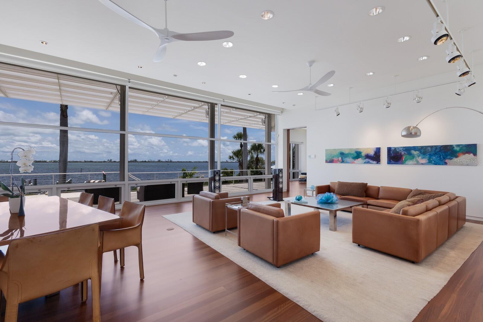 PENDING TAKING BACK UP OFFERS. A Masterpiece of Coastal Luxury and Engineering Excellence. Designed by acclaimed Chicago architect Howard Holtzman and masterfully executed by BCB Homes of Naples, this exceptional estate represents the pinnacle of timeless design and coastal resilience. Set against a backdrop of breathtaking sunsets over Little Gasparilla Island and the Gulf. 
 
Crafted with concrete and steel for enduring strength and peace of mind, the home blends elegant architecture with advanced engineering. Walls of impact-rated glass open to elevated terraces, a vanishing-edge pool, raised spa, and lush tropical landscaping, creating a seamless indoor-outdoor lifestyle just minutes from Boca Grande.
 
*Marine Facility & Waterfront Features *Top-tier deep water dockage for yachts in the 50-foot class *Two additional slips one for boats in the 35-foot class *Private boat lift 7,000lb *Unobstructed views across protected waters of Placida Harbor *Interior Highlights 5 private bedrooms, each with independent outdoor access *5 luxurious bathrooms  *An extraordinary master suite featuring a custom dressing room and expansive walk-in closet * Refinished Brazilian cherry flooring * Designer lighting throughout *Chef’s Kitchen *Custom Varena & Foster stainless steel kitchen *Premium appliances including Sub-Zero, Miele, and Bosch *Extensive Upgrades & Smart Features * New roof and eight new HVAC units * 45kW rooftop generator *Flood mitigation panels across the lower level *droll-down hurricane shutters covering custom impact rated windows and doors *Raised pool equipment platform for flood resilience *Integrated weather station *Full security system with cameras *Custom furnishings included for a seamless, move-in-ready experience 

Do you possess a taste for uncompromising quality and refined living? If so, this home is the rare gem you’ve been searching for. A true masterpiece in both design and function, it offers everything you need to elevate your lifestyle to the highest standards.
 
This estate is more than just a home; it's a reflection of success—an unparalleled retreat that blends world-class craftsmanship, breathtaking natural beauty, and the finest amenities. It's not just where you live, it’s how you live. And here, every detail has been thoughtfully curated to meet your discerning tastes. With the private Coral Creek airport just 5 minutes away, it's easy to pop in for a private look. Contact me today.