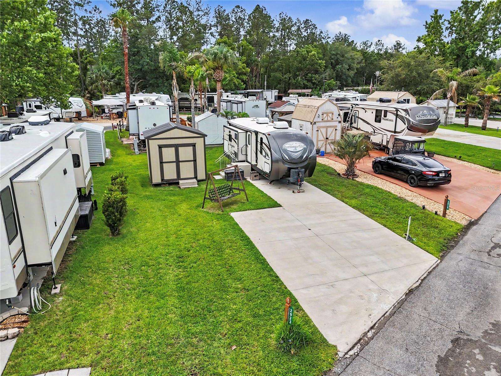 Welcome to your perfect vacation getaway, full/part time retirement resort-home, or income-producing opportunity. Wilderness RV Park Estates is a 55+ community, located in beautiful Silver Springs, Florida! This paved RV site is ready for your RV adventures with full hookups — including water, sewer, and electric connections. 20, 30 and 50 amp breakers. Propane is conveniently available on site at the resort office.  Whether you're looking for a personal retreat or a great investment, this lot fits the bill. Short-term and long-term rentals are allowed and offer a great avenue to generate rental income! Wilderness RV Park Estates offers resort-style amenities including: Sparkling Pool and relaxing Hot tub, Hiking trails, Two dog parks, Canoe and Kayak access to the scenic Ocklawaha River, Fitness center with Sauna and Steam room, Game room, Laundry facilities, Gathering pavilion, and Community Hall. Many planned activities bring neighbors together for fun and fellowship. Low quarterly HOA fee of $578 includes water, sewage, trash, lawn care and amenities. For the adventurers at heart, you're just minutes from the famous Silver Springs State Park, perfect for kayaking, glass-bottom boat tours, hiking, and wildlife spotting. The Ocala National Forest is nearby for endless outdoor activities like ATV trails, horseback riding, fishing, and camping. Plus, you're a short drive to the historic charm of downtown Ocala with shopping, dining, and cultural events. This property is clean, well-maintained, and move-in ready!!