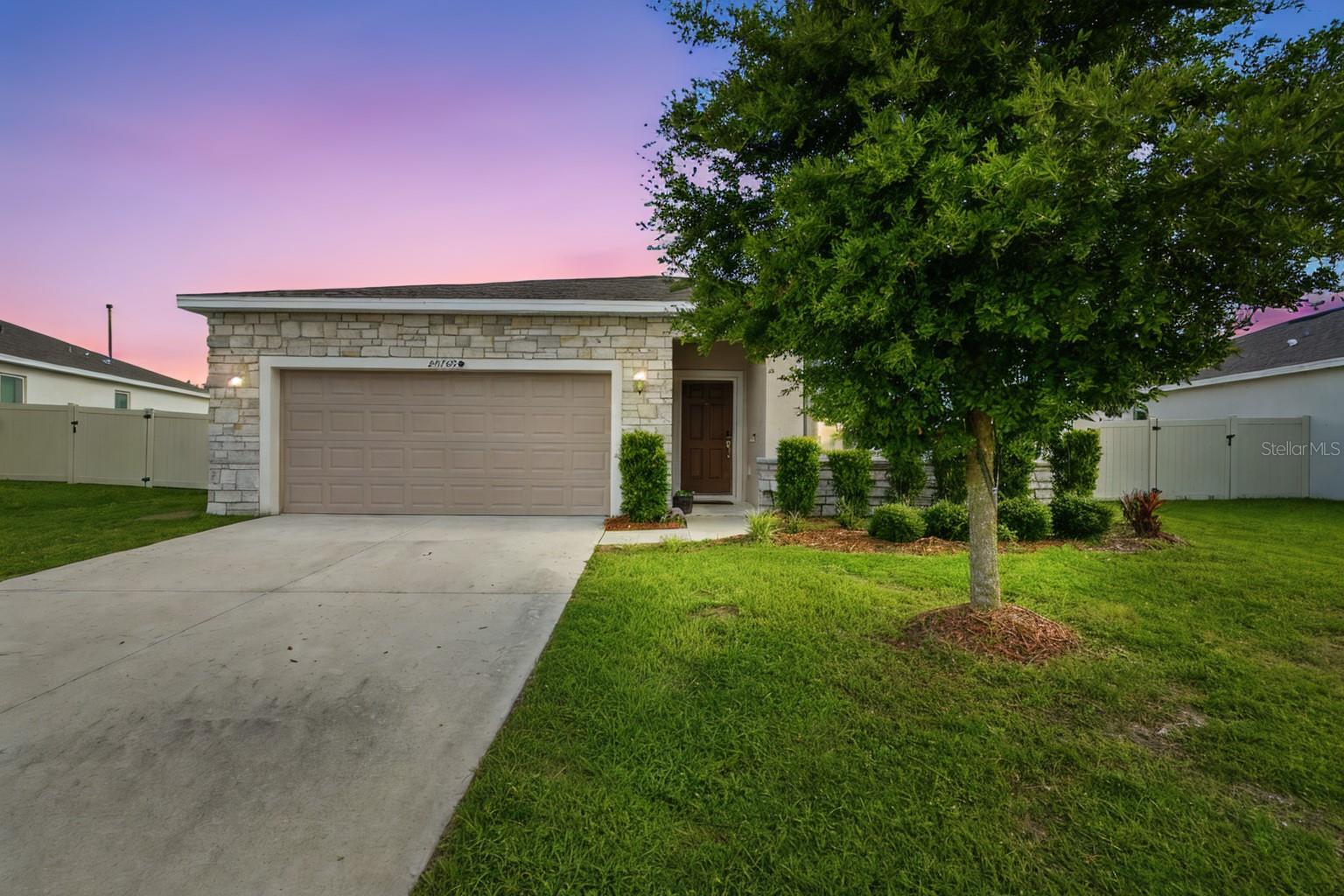 Why wait months to build and pay extra for upgrades when you can have it all right now? NO CDD! This beautifully maintained 4-bedroom, 2-bath home is loaded with value and offers the perfect blend of space, comfort, and convenience. The open-concept floor plan is ideal for everyday living and entertaining, while the dedicated laundry room and generous storage make life a little easier.
Step outside to your fully fenced backyard, perfect for pets, playtime, family gatherings, or simply relaxing after a long day. Located in a newer community featuring a neighborhood park and resort-style pool, you'll enjoy all the amenities without the high costs often associated with new construction.
Conveniently situated near major highways, this home offers an easy commute to Orlando in approximately 35 minutes. Just minutes away, discover the charm of Mount Dora, famous for its year-round festivals, waterfront dining, boutique shopping, farmers markets, and boating on the Harris Chain of Lakes. Whether you're looking for more space, a great location, or exceptional value, this home checks all the boxes!