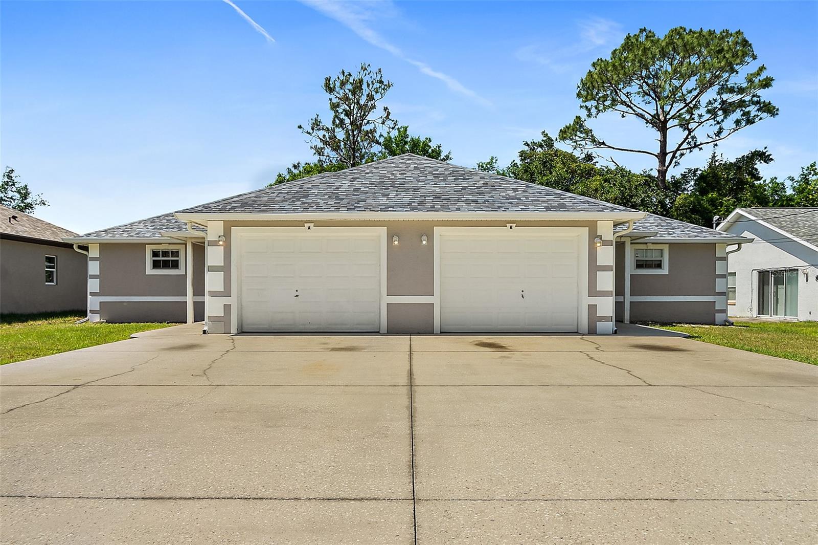 Welcome to the Spacious 3 Bedroom 2 Bath each side Duplex in Palm Coast, FL. This beautiful Duplex boasts a generous floor plan per side with vaulted ceilings and tile throughout, creating a sense of openness and elegance. The property features three well-sized bedrooms and two full bathrooms, offering ample space for comfort and convenience per side. The home is equipped with newer air conditioning systems, ensuring a cool and comfortable environment during the warm Florida months and newer roofs. The open patio is perfect for enjoying the outdoors and the garage door opener adds an extra layer of convenience. This duplex is a perfect blend of style, comfort, and functionality. 
Both sides are rented. Call to schedule your viewing today.