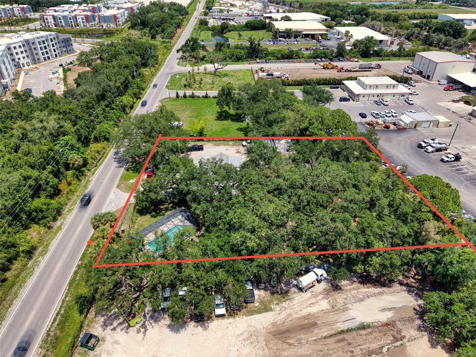 Rare opportunity to acquire approximately 1 acre across two contiguous parcels in one of Manatee County's growing industrial corridors. Zoned HM (Heavy Manufacturing) with Industrial Heavy (IH) Future Land Use, this property offers exceptional flexibility for owner-users, investors, and redevelopment opportunities.
The property features an existing concrete commercial building with solid bones, multiple parking areas, two points of ingress and egress, and approximately 9,500 vehicles per day (FDOT 2025 AADT), providing excellent visibility and accessibility.
A residential structure is also located on the property and conveys as-is, offering renovation or redevelopment potential depending on the buyer's vision.
Whether you're expanding an existing business, looking for a live/work opportunity, or investing in industrial property with long-term upside, this unique offering delivers functionality, visibility, and future potential.
Buyer to verify all measurements, zoning, permitted uses, and development opportunities with Manatee County.