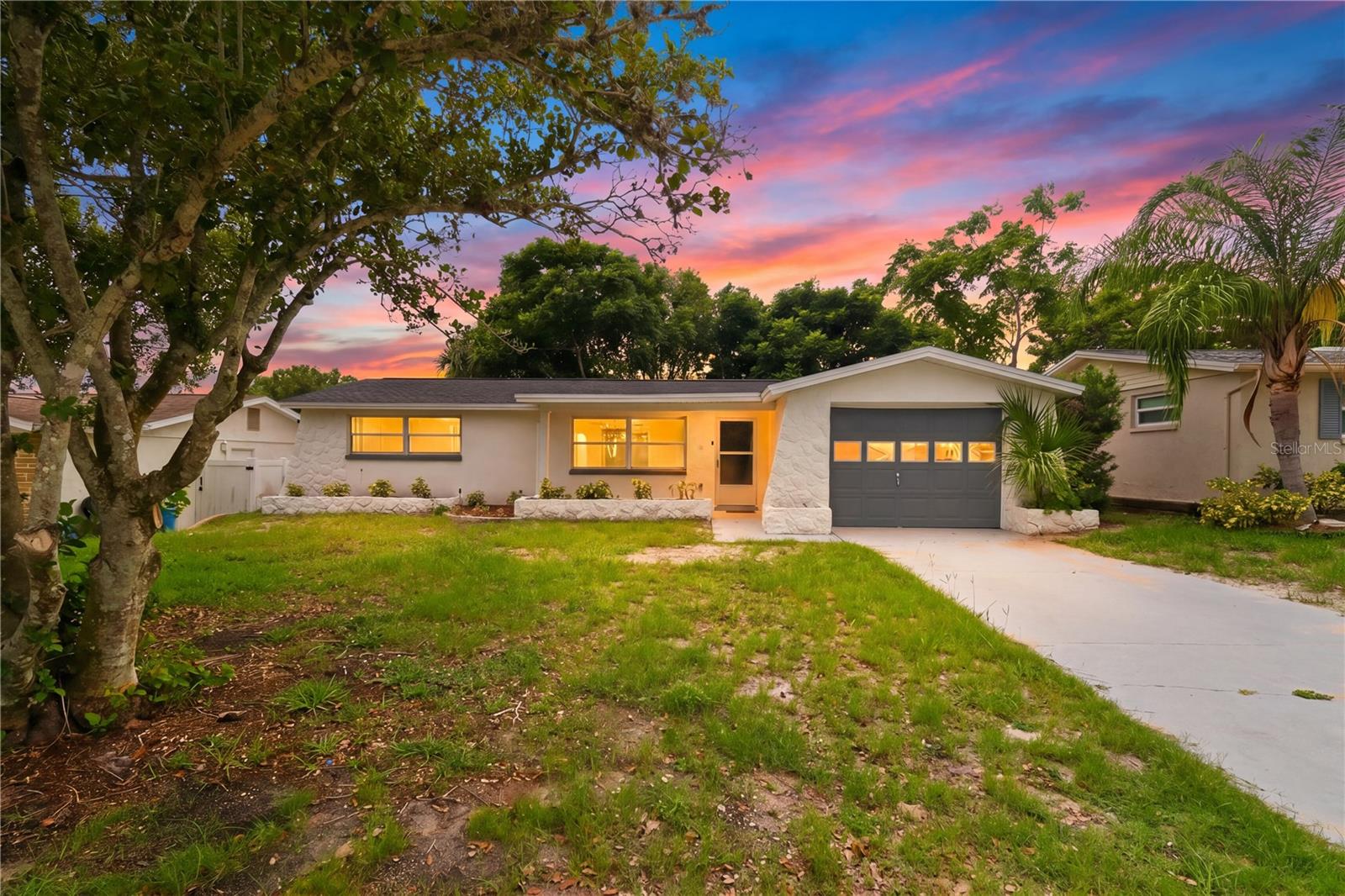 MOVE-IN READY AND FULLY RENOVATED! Welcome to this beautifully updated 3-bedroom, 2-bath home with a versatile den, offering the perfect blend of style, comfort, and convenience. Thoughtfully renovated from top to bottom, this home features luxury vinyl plank flooring throughout, fresh interior paint, updated lighting, modern accent walls, and an open, airy layout that feels both inviting and functional.

The stunning kitchen is the centerpiece of the home, showcasing quartz countertops, tile backsplash, NEW stainless steel appliances, a breakfast bar, and a built-in wine cooler. Both bathrooms have been tastefully remodeled with updated vanities, countertops, and fixtures, creating a clean and modern feel throughout.

Enjoy peace of mind with a NEW ROOF (2026) and NEW AC (2026), helping to keep utility costs down while providing reliable comfort year-round. The flexible den offers the perfect space for a home office, playroom, fitness area, or additional living space.

Step outside to the screened porch overlooking the backyard, ideal for morning coffee or relaxing evenings. The oversized one-car garage provides additional storage and includes a convenient laundry area.

PETS WELCOME! Privately owned and professionally managed locally, making communication easy and responsive. No HOA, no restrictive community rules, and no lengthy approval processes. Easy application process with quick approvals available for qualified applicants.

Located in a desirable New Port Richey location close to shopping, dining, parks, entertainment, and Gulf Coast beaches. NOT IN A FLOOD ZONE. Homes with this level of renovation, flexibility, and convenience rarely become available for rent. Schedule your showing today before it's gone!