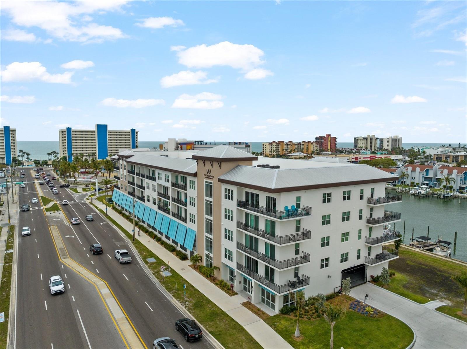This beautiful luxury condo is move-in ready and offers the perfect opportunity to enjoy waterfront living year-round or own a Florida vacation retreat. Short-term rentals are permitted with a 2-week minimum, and the property allows two pets with no weight restriction.

Ideally located with views of both the Gulf of Mexico and the Intracoastal Waterway, this top-floor residence offers a wonderful combination of scenery, convenience, and lifestyle. Enjoy the waterfront setting from the pool area, take a short stroll to the beach each morning, or head out for sunset just blocks away. Dining, the post office, a waterfront recreation park, Madeira Beach City Hall, the library, grocery shopping, and more are all just steps away.

This 2-bedroom, 2-bath condo is located on the 5th floor and is a prime end unit, offering added privacy along with extra windows that fill the home with natural Florida sunshine. High ceilings and a spacious floor plan enhance the bright, open feel, while the neutral color palette creates a clean and inviting interior. Everything is new.

The large primary suite features an ensuite bath and walk-in closet. A washer and dryer are conveniently located inside the unit. Additional amenities include interior lobby elevators, a gated community, key fob entry, and under-building garage parking with storage space.