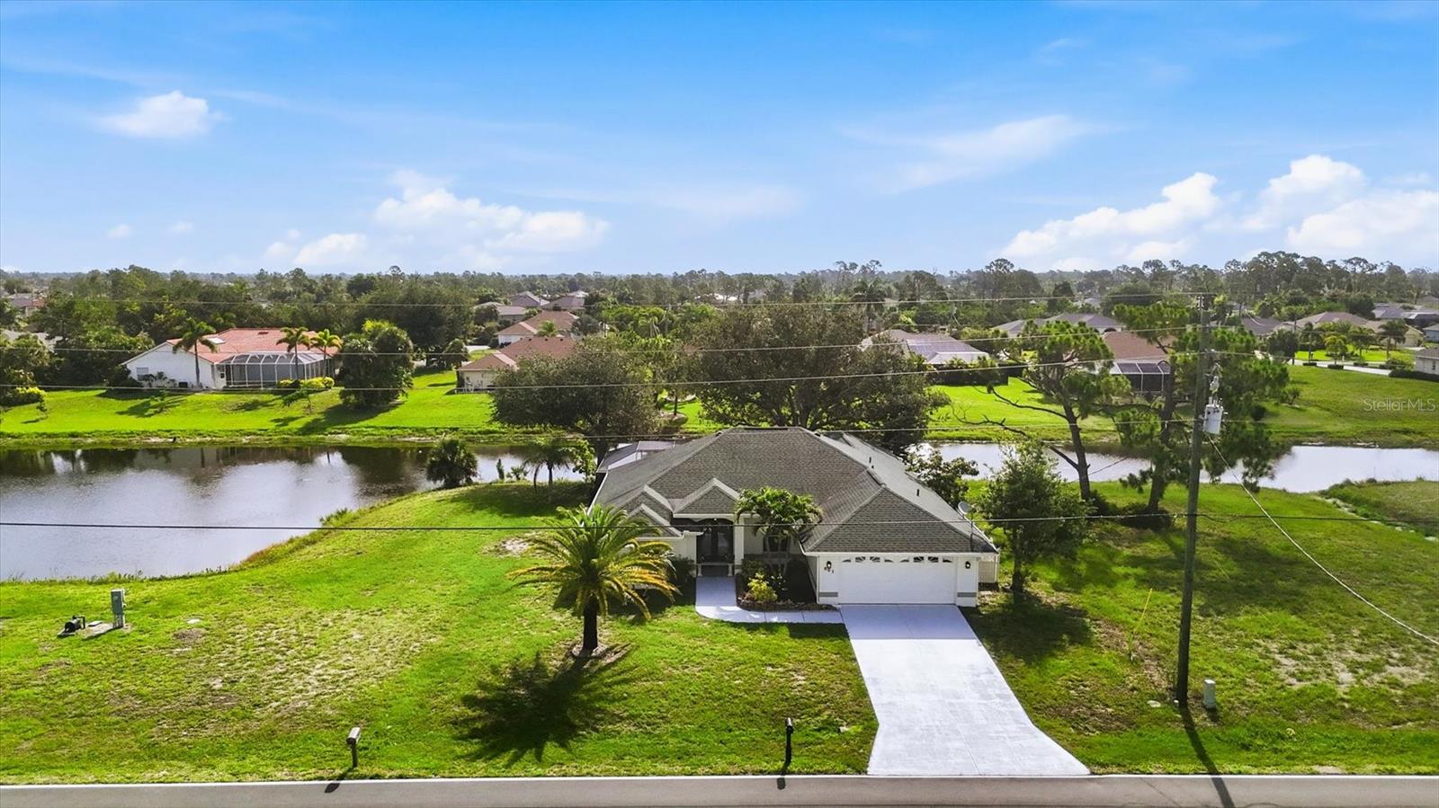 Nestled in the highly desirable community of Rotonda West in Englewood, Florida, this spacious waterfront home offers comfort, functionality, and endless possibilities. Situated along Rotonda's scenic waterways, the property features canal-fed irrigation and the ability to build a dock and enjoy boating through the Rotonda canal system. The beautifully expanded kitchen is the heart of the home, boasting an additional 187 square feet of living space, Corian countertops, a Stylestone-topped island with sink, a farmhouse sink overlooking the backyard and canal, double ovens with a convection upper oven, recessed lighting, abundant storage, and convenient electrical outlets throughout. The large eat-in kitchen area is enhanced by an elegant tray ceiling and offers plenty of room for gathering and entertaining.

The oversized living room features soaring ceilings, decorative plant shelves, a ceiling fan, and sliding glass doors leading to the pool area, creating a bright and inviting atmosphere. Two additional flex spaces provide endless options for a formal dining room, breakfast nook, home office, reading room, or sitting area. The spacious primary suite offers pocket sliders to the pool, dual closets, and an ensuite bath featuring dual sinks, a walk-in shower, and a handicap-accessible jetted tub. Additional highlights include wood flooring, a tankless water heater, a well-appointed laundry room with shelving, accordion shutters, roll-down shades on the lanai, LeafGuard gutters, and a garage utility sink. Located just minutes from Englewood's beautiful Gulf beaches, shopping, dining, golf courses, and world-class fishing, this exceptional waterfront home delivers the perfect blend of comfort, convenience, and Florida living.