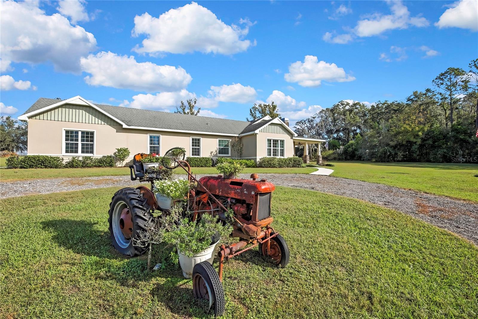 Wow! A beautiful family home with an extra Mother-in-law suite that provides full privacy. This home is situated in an area known for being the highest elevation in Florida. Sit on the porch and enjoy the beautiful sunsets of Northeast Pasco County area, just 30 miles from Tampa. As you walk into the main house, you are met with a light and open floor plan leading to an immaculate upscale kitchen. There are 3 large bedrooms and 2 full baths in the main home. The Mother-in-law suite has 1 bedroom and 1 bath with a walk-in closet, living room, with a kitchen.