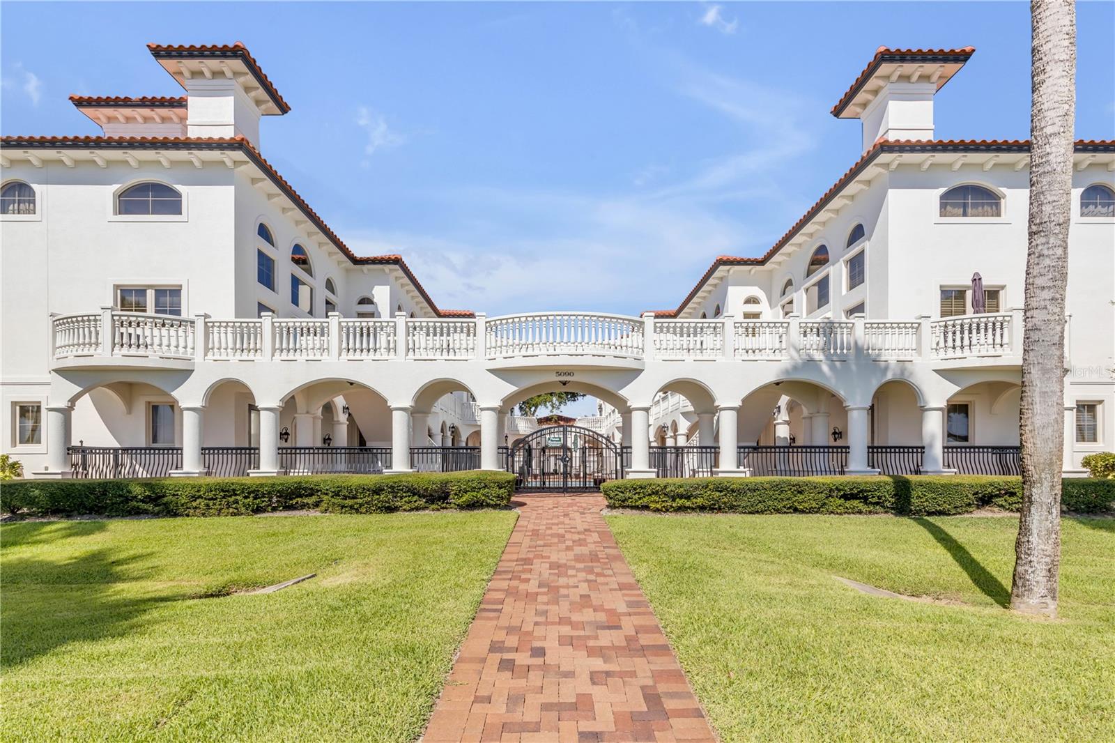 Welcome to Portofino at Port Orange, an intimate eight-residence waterfront community where Mediterranean architecture, sweeping river views, and maintenance-free living come together in a home unlike the typical condominium. With 2,704 square feet across three thoughtfully designed levels, a private interior elevator, and a detached two-car garage, this residence delivers the space and separation of a single-family home with the ease of boutique condo living.  The ground floor offers exceptional flexibility with two bedrooms, a den with wet bar, and a full bathroom. Each room has its own exterior entrance, creating a private and comfortable setting for overnight guests, a home office, hobbies, or a quiet retreat away from the main living areas.  Take the elevator or stairs to the dramatic second-floor living level, where soaring 20-foot windows frame views of the Halifax River and fill the interior with natural light. Custom drapery and motorized blinds provide effortless control, while hardwood flooring, porcelain tile, and crown molding add warmth and architectural character. The open living and dining areas flow naturally toward a balcony overlooking the serene courtyard, community pool, and Intracoastal Waterway—the perfect backdrop for morning coffee, evening conversation, or simply watching boats move along the river.  The chef’s kitchen is designed for both everyday living and entertaining, featuring granite countertops, stainless steel appliances, abundant cabinetry, and a generous walk-in pantry. A conveniently located powder room completes the main living floor.  The entire third level is dedicated to the owner’s penthouse suite. This private sanctuary includes a sitting area, spacious walk-in closet, and spa-inspired bathroom with a garden tub and separate shower. A Juliet balcony overlooks the living room below, preserving the home’s open architectural flow while giving the suite a distinctive sense of arrival.  Outside, Portofino’s eight residences surround a peaceful private courtyard and pool. Covered boat docks enhance the waterfront lifestyle, while the boutique scale offers a welcome sense of privacy rarely found in larger condominium communities.  This is a home for those who want fewer maintenance responsibilities without sacrificing space, individuality, or direct connection to the water. From relaxed mornings overlooking the river to dinner parties beneath the dramatic windows, every level supports a different part of the way you live.
**Practical details:** Up to two pets permitted, with a maximum weight of 30 pounds each. Community amenities include a courtyard pool and covered boat docks. Conveniently located near restaurants, shopping, area beaches, and everyday services.