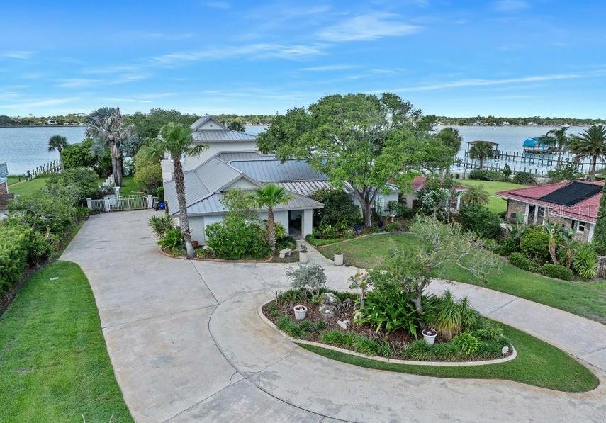 Under contract-accepting backup offers. 776 Riverside Drive is being offered for the first time in more than 4 decades after being meticulously cared for, renovated, and added onto by steadfast owners whose pride of ownership is apparent at every turn. Totaling nearly 6,000 sq ft, including sprawling waterfront verandas and a 3 car garage, the main living space features 5 bedrooms and 4 baths along with beautiful riverfront living and dining spaces within the 4,254 sq ft interior. A generous eat-in island kitchen opens onto a grand river room where panoramic water views are enjoyed beneath cathedral ceilings. A spacious family room features a gas fireplace and custom built-ins while the very generous dining room is sizeable enough to entertain a crowd. French doors open onto the elevated patio surrounding the sparkling blue pool where river views and breezes are a constant.

Just beyond, a sprawling oak shaded lawn with an open-air lanai is the perfect place to take in the sunset. The floorplan here features two primary suites, one upstairs and one on the ground floor. The original downstairs primary currently serves as an office/den; however, it could be the ideal guest or in-law quarters with a lovely bath, coffee bar, and walk-in closet. Three more bedrooms occupy a quiet waterfront wing of the home where two bedrooms share a common bath and the third features an en-suite with a walk-in closet. The upstairs primary suite was added in 1996 by general contractor Stan Shirah and recently received a complete renovation. The space is the ultimate owner's retreat with 1280 sq ft including a private riverfront sitting room, luxurious bath with jetted tub, cavernous shower, double vanities, two generous walk-in closets and a private 32' riverfront covered verandah. Custom dock with two covered boat lifts in excellent condition. Indoor utility room. The recent 50-year standing seam Galvalume roof is beautiful and will provide decades of 'peace of mind. Generac generator. Excellent condition inside and out!
