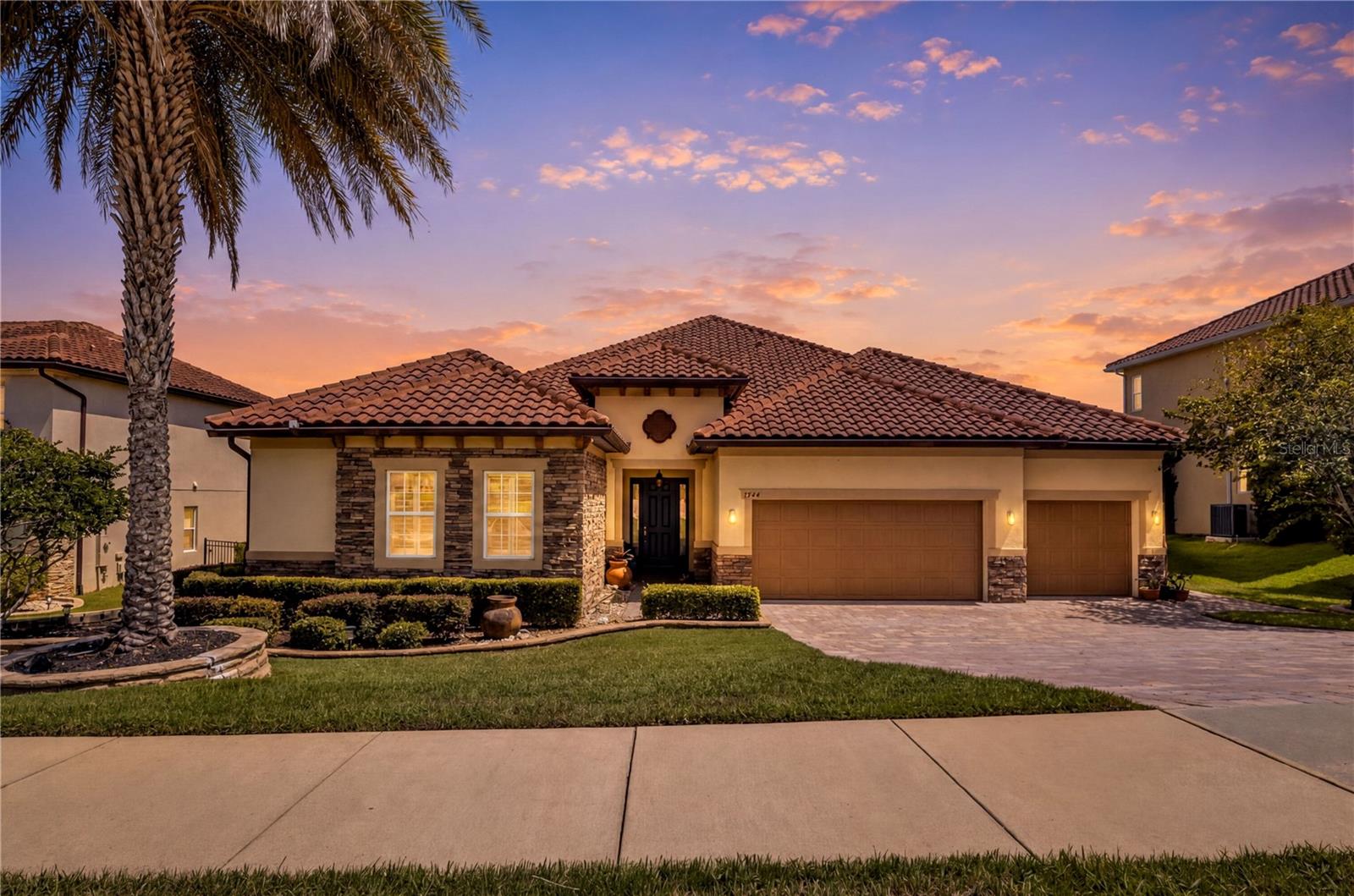 ROLLING HILLS and LAKE VIEWS make this Bella Lago Home a Relaxing and Exceptional Experience with Nature. Enjoy
Sophisticated Design and Effortless Living in this True Florida Style Gated Community. 4 Bedrooms and 4 Full Bathrooms with 3190
square feet of Living Area. Desirable ONE STORY Open Floor Plan with Beautiful Tile throughout. Stunning Chef's Kitchen with Viking
Gas CookTop, Stainless Steel Appliances and Built-In Double Wall Ovens, Huge Center Island, and Formal Dining are perfect for Family
Gatherings and Holiday Entertaining. Abundant Cabinet Storage, Butler Pantry and Preparation area. The Kitchen and Breakfast Nook are open to the large Family Room overlooking Covered Lanai with Garden and Water views highlighting Clermont's
Rolling Hills and Chain of Lakes! Split Bedroom design offers privacy for the Owner's Suite and guests or extended family. The
Primary Bedroom also has additional and extended views of mature landscaping and starry night lights PLUS California Closet,
Garden Tub, Separate Shower and Double Vanity Sinks. Owners have spared no expense upgrading Custom Touches such as Crown
Molding, Designer Lighting and Fixtures, adding a sense of Class and Sophistication. The 3 car garage with clean floor coating and
Storage Racks provides plenty of room for cars and toys. Walk out to your Fully Fenced yard and Professionally Landscaped with
Natural Florida Fruit Trees and Gazebo Sitting areas, pavers and Covered Lanai.This home is built with Solid Construction Materials,
Tile Roof and attractive Stone Accents. Integrated wiring system and Alarm is also included for additional convenience and security.
Bella Lago is a Gated, Walkable and Friendly Community with Dock Access to Lake Felter, Playground and Lakefront Gazebo. Enjoy
the Heart and Soul of Clermont with Easy access to Shopping and Restaurants, Golfing, Boating and much more.