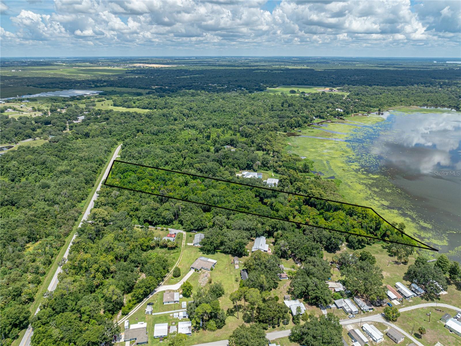 THIS IS BEAUTIFUL LAKEFRONT ACREAGE WITH MAJESTIC TREES located on Lake Pierce in Lake Wales, Florida.  The property is 6.32 acres.  The lot has 415 feet of lakefront and is just waiting for a new owner to build their dream home.  The depth of the property (1044 feet) will provide lots of privacy and plenty of space for your residence, pool, storage, etc.  This amount of lakefront acreage is at a premium in Central Florida.  Lake Pierce is a 3,800+ acre lake known for great fishing.  The property is located close to Legoland, Disney and both East and West coast beaches.