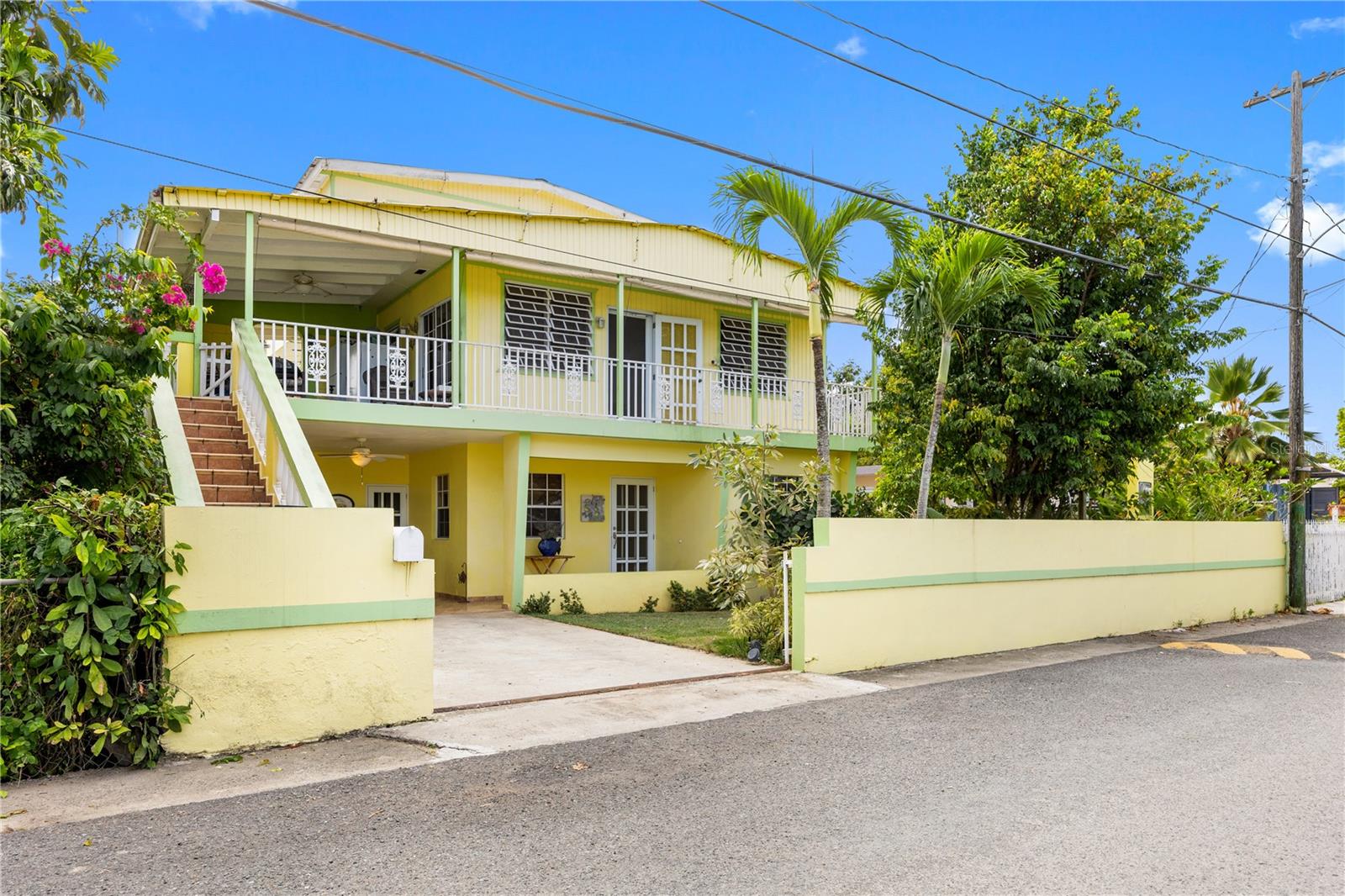 Charming Furnished Home in the Heart of Rincón – less than 300 meters to the Beach!
Located in a prime area of Rincón, this charming two-story home offers the perfect blend of tropical living and convenience. Just a short walk to the beach, this property is ideal for those looking to enjoy the relaxed coastal lifestyle that Rincón is famous for. The home features a welcoming façade with tropical landscaping, a spacious balcony/terrace, and a private gated entrance with driveway parking. The elevated upper level provides a bright and airy living space, perfect for enjoying the Caribbean breeze. Inside, the property offers comfortable living areas and a functional layout with plenty of natural light. The outdoor areas and balcony provide great space for relaxing, entertaining, or simply enjoying the peaceful neighborhood surroundings. This property is being sold furnished, making it move-in ready and an excellent opportunity for a primary residence, vacation home, or investment property in one of the most desirable towns on Puerto Rico’s west coast.