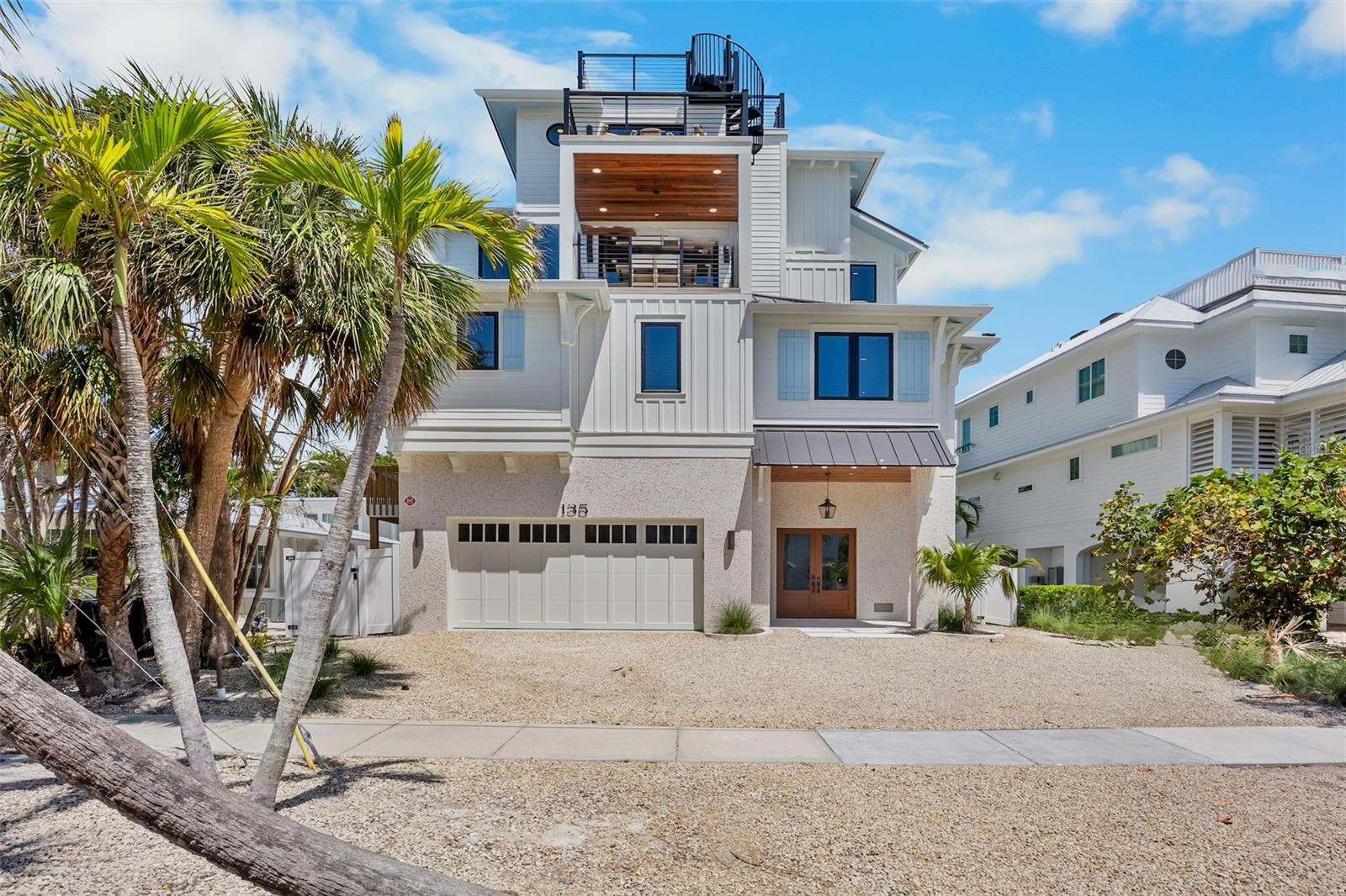 Experience elevated coastal living just moments from the powdery sands of Siesta Key Beach and the heart of Siesta Village. This newly built island escape offers eight bedrooms and eight and a half baths, thoughtfully designed for style, comfort, and effortless group living.
Step into your own resort-inspired backyard with a shimmering pool, relaxing spa, and a waterslide wrapped in tropical landscaping. After a beach day, rinse off in the custom surfboard-style outdoor shower, then ride the elevator up to the rooftop deck for sunset views that stretch across the Gulf of Mexico.
Inside, the open main living level feels bright and inviting, anchored by a designer kitchen with stainless-steel appliances, a wine fridge, and a spacious island perfect for cooking, dining, and gathering. Each bedroom features its own private bath, offering seven king suites plus a fun bunk room that guests will love. Additional conveniences include an elevator to all floors, a full laundry area, and coastal touches that tie the entire home together.
With its unbeatable walkability to the beach and Village, breathtaking views, and luxury finishes throughout, this home delivers the ultimate Siesta Key lifestyle.