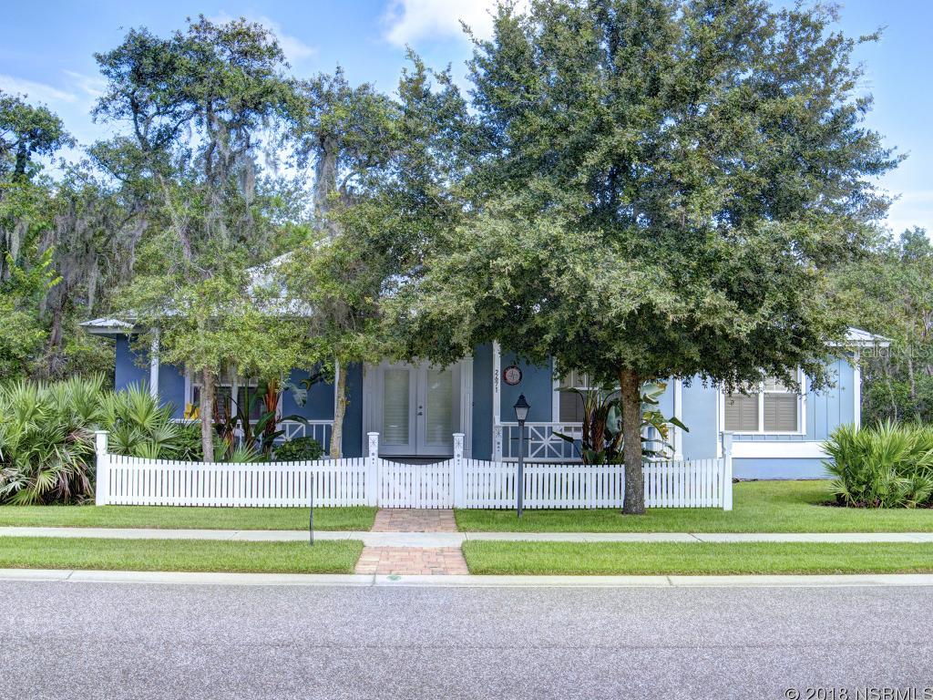 Old Florida Charm exudes from this well appointed bungalow.  Quaint picket fence beckons you onto the enormous front porch complete with swing.  Enter the homes great room boasting beautiful built ins, slate like flooring and coffered ceilings.  Dining banquette has two benches built in. Generous sized kitchen has antique glass cabinet doors on some uppers.  Plenty of counter for all your cooking needs.  Natural gas for range, hot water heater, heat and Gas Fire pit for back yard  ambiance.  3rd bedroom is perfect den/office and MBR has an office space as well which could be converted to additional closet space if desired.  Beautiful paver back patio focused on the fire pit and a generous sized covered porch.  Wide drive to garage off back alley access.  Tropical, quaint and model perfect.Security alarm, plantation shutters  and cellular blinds. Hurricane panels. Located in a gated Old Florida Style neighborhood built exclusively by Hickson Construction.  Surrounded by a Doris Leper 2000 acre pristine preserve.  Access right across the street from home for a walk in the woods.  This is paradise found.  Hurry this is not going to last long. ;Water: City
