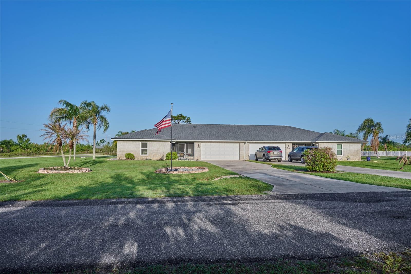 CALLING ALL FLORIDIANS! Are you tired of doing lawn work all summer? Would you love to have a pool but you don't want the upkeep? This property is located in a neighborhood outside the gate but within Indian Lake Estates (ILE). The eight Church Square homeowners formed their own community and decided to share the expenses of a year-round heated pool, landscape and exterior maintenance, and reserves for long-term exterior maintenance. The roof on this home was replaced in 2024 with those reserves. A1 is a split-plan, 2-bedroom, 2-bath home with 1400 square feet of living space, PLUS 726sf of garage and porch space, for a total of 2126sf! This home is open and airy and functional and full of natural light. There are informal and formal spaces for entertaining. The screen porches are located in front and back, so you can enjoy sunrises and sunsets without worrying if the grass needs to be cut or if the bushes need to be trimmed. Travel to see friends or family at the last-minute without worrying about who is going to maintain the pool. Everything will be in place when you return. The duplex construction of the home shares ONLY garage/utility space with the neighbor, so your private space is private. In addition to this exclusive neighborhood, you have all the amenities of ILE: the golf course, the fishing pier, the marina, the lakefront pavilion and the 23,000sf clubhouse for activities and events. This property is halfway between the two neighborhood restaurants when you feel like dining out with friends and neighbors. The roads are private, so drive your golf cart to the clubhouse for a round of golf or explore the 4000+ acres of private neighborhood property and over 135 miles of road to listen or watch for birds and other animals. As you begin to plan your future in Florida, consider living a serene and private life in this neighborhood of Indian Lake Estates. The active ILE community offers dances and concerts, karaoke and trivia nights, weekly Domino and Mahjong games, Bingo, movie nights, a donation library of 7000+ books and monthly book club, pickleball and tennis courts, just to name a few. Indian Lake Estates is a perfect balance of privacy and activity. Call your agent today to view this property and see how fun it will be to live where the cool kids hang out.