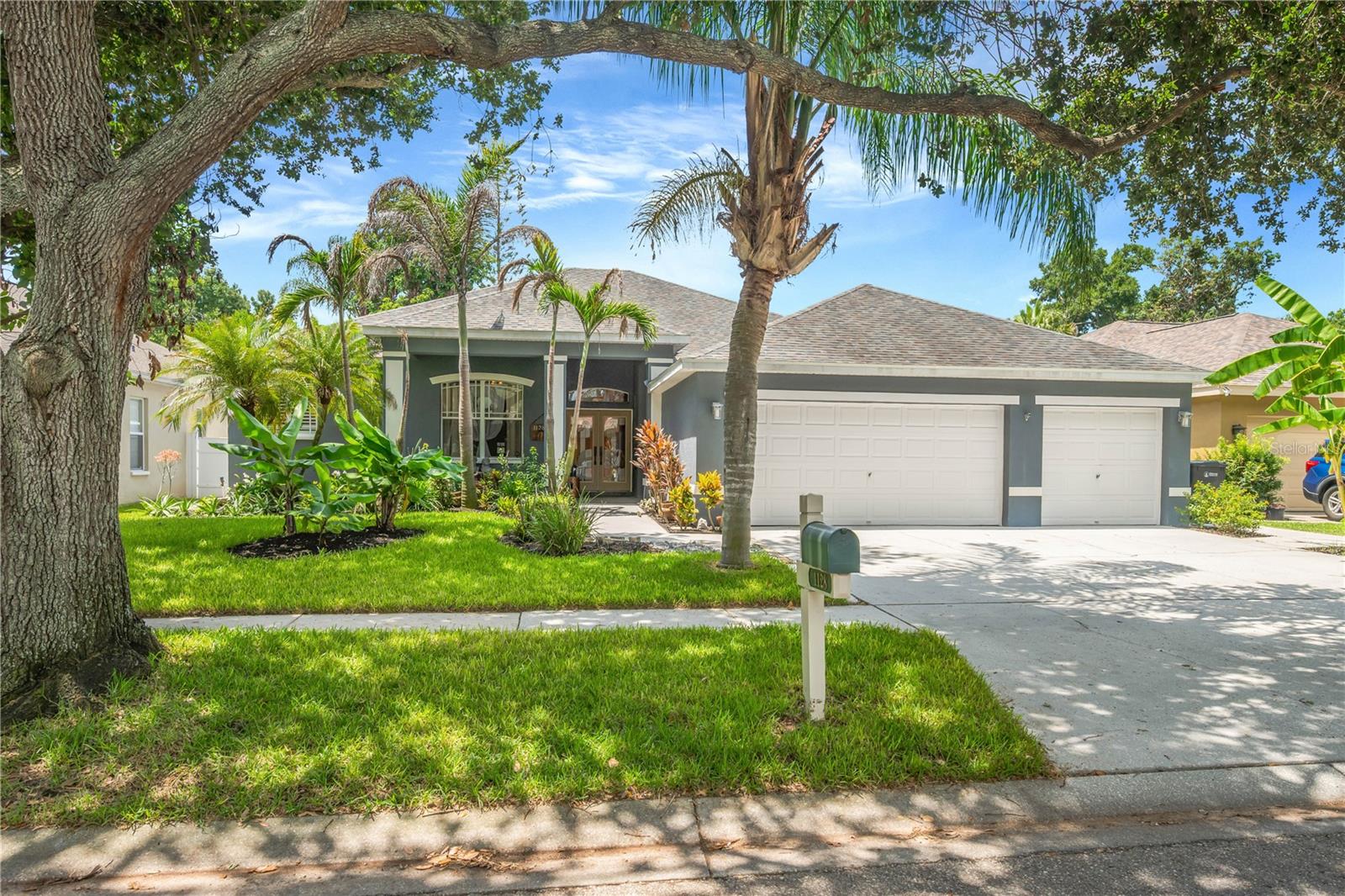 This exceptional home checks every box - 4 bedrooms, den/office, bonus room, 3 full baths, 3-car garage and an expansive screened lanai.  This home combines generous living spaces with countless upgrades that showcase quality, comfort and style at every turn.  Enter through the elegant stained-glass double doors into the foyer which opens to the formal living and dining rooms.  Just beyond, the spacious family room opens to the kitchen, offering a seamless space designed for gathering and entertaining. The original lanai has been completely enclosed to further extend the home’s living space.  The spectacular gourmet kitchen is truly the centerpiece of the home and has been thoughtfully redesigned and remodeled with attention to every detail.  The most discerning chef will love the massive 8’x6’ granite island with breakfast bar seating, custom 42” wood cabinetry with pull-out shelving and full-extension drawers, top-of-the-line stainless steel appliances, reverse osmosis water system with instant hot water, upgraded fixtures, and beautiful slate-pattern porcelain tile flooring.  The luxurious owner’s suite is a private sanctuary with an attached sitting room for relaxing, reading or an additional home office space.  The oversized walk-in closet is enhanced with a custom wood organization system.  The fully remodeled spa-inspired bathroom has two vanities, designer fixtures, an extended shower with dual rainfall shower heads, and a private water closet.  The home also features three generously sized secondary bedrooms and a versatile den arranged in a three-way split floor plan that provides privacy and flexibility for family and guests.  Outside is a fully fenced backyard oasis featuring lush landscaping and mature fruit trees with an eco-friendly reclaimed water irrigation system. The crown jewel is an enormous 37x18 screened and covered lanai—the ultimate space for year-round outdoor living and entertaining. The backyard also comes complete with a 16x12 Tuff Shed with a fully finished interior, lighting and air conditioning making it ideal for a workshop, studio or fitness area.  You get all of this along with top rated schools, shopping, restaurants and everything Tampa Bay has to offer!