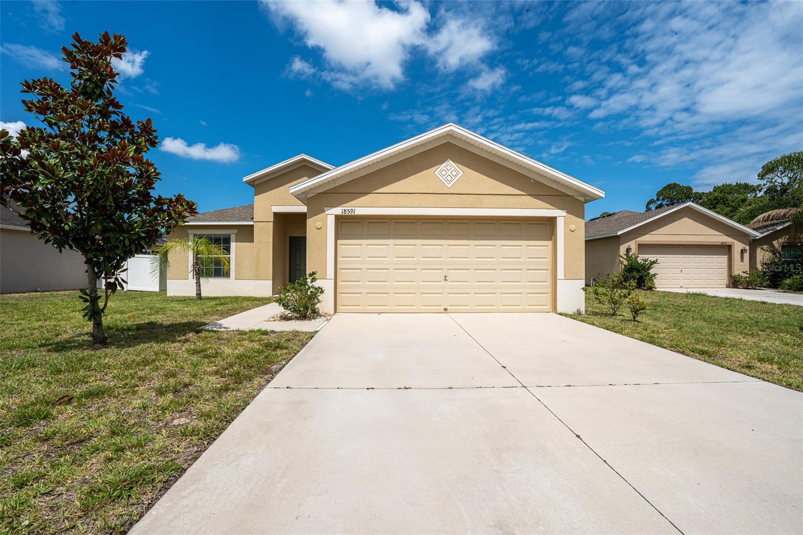 Welcome home to The Briar Oaks Community. The Arlington floor plan features a split plan, 3 bedrooms and 2 baths. The kitchen is in the front of the home with views out the front window and through to the back of the home. Look at the conservation area while washing dishes. As you go through the kitchen, there is a cafe area and an indoor laundry room, that enters into the garage. The combo Living/Dining area has higher ceilings with views of the back yard. Primary bedroom is on one side, with the other 2 bedrooms separated by the Family room, and a bathroom in the hall between them. Sit on the back covered patio to watch the Sunset. There have been deer and otter sightings overlooking the conservation area. No homes or buildings can be built behind the home. Featuring an AO Smith Hybrid hot water heater in the garage. Water heats up with the heat outside first. There is also a Taexx in wall pest system. Call the company and they come out to put pest control through the tubes in the wall from outside. The home has storm shutter panels for each window and patio door. They are nestled together in the garage for easy access. Just place them on the hardware that is installed for each window. You will notice the other homes have the same, installed by the builder. Contact listing agent for information regarding the FHA assumable loan. Floor plan shown is in reverse.