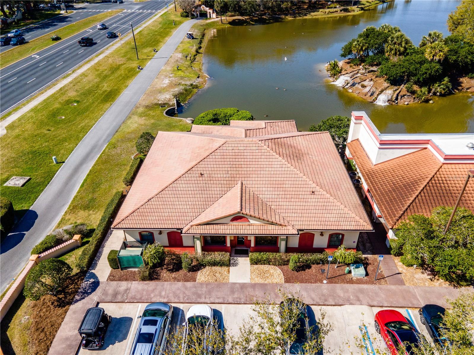 Rare opportunity to acquire a professional medical office building in a prime Lady Lake/Villages location, featuring direct frontage on US Hwy 441, waterfront views, and golf cart accessibility via The Villages path system.

This property offers usability for medical or professional office use, with strong long-term positioning in one of Florida’s fastest-growing markets with a large Lobby with, receptionist area, 7 exam rooms, a lab, a shot room (currently occupied by an allergist), two large physician offices, a managers office, file space, supply closet, and outdoor patio, plenty of parking, and more!

The property itself overlooks a pond, creating a calm, patient-friendly environment—a unique advantage for any healthcare or wellness-focused practice.  Also included is a separate lakefront lot, ideal for creating a branded outdoor space, wellness garden, or private retreat for staff and clients—helping you stand out in a competitive healthcare environment.

Ownership will provide access to The Villages Charter School system for eligible owners and employees, a highly sought-after advantage that adds significant personal and professional value.

Highlights:

High visibility for patient growth
Medical/professional office building – ideal for owner-user or investor
US Hwy 441 frontage (high visibility & traffic)
Waterfront setting on-site (pond views)
Bonus lakefront vacant lot included
Golf cart access via The Villages path system
Located in a high-growth, high-demand area
Potential eligibility for The Villages Charter Schools

This is more than just a building—it’s an opportunity to elevate your practice, attract better staff, and build long-term equity in a thriving market.  This is a rare chance to combine business presence, lifestyle benefits, and long-term upside in one unique offering.
Stop leasing and take control of your future with this turnkey medical/professional office opportunity in Lady Lake, perfectly positioned on US Hwy 441 with golf cart access from The Villages.  Schedule your showing today!