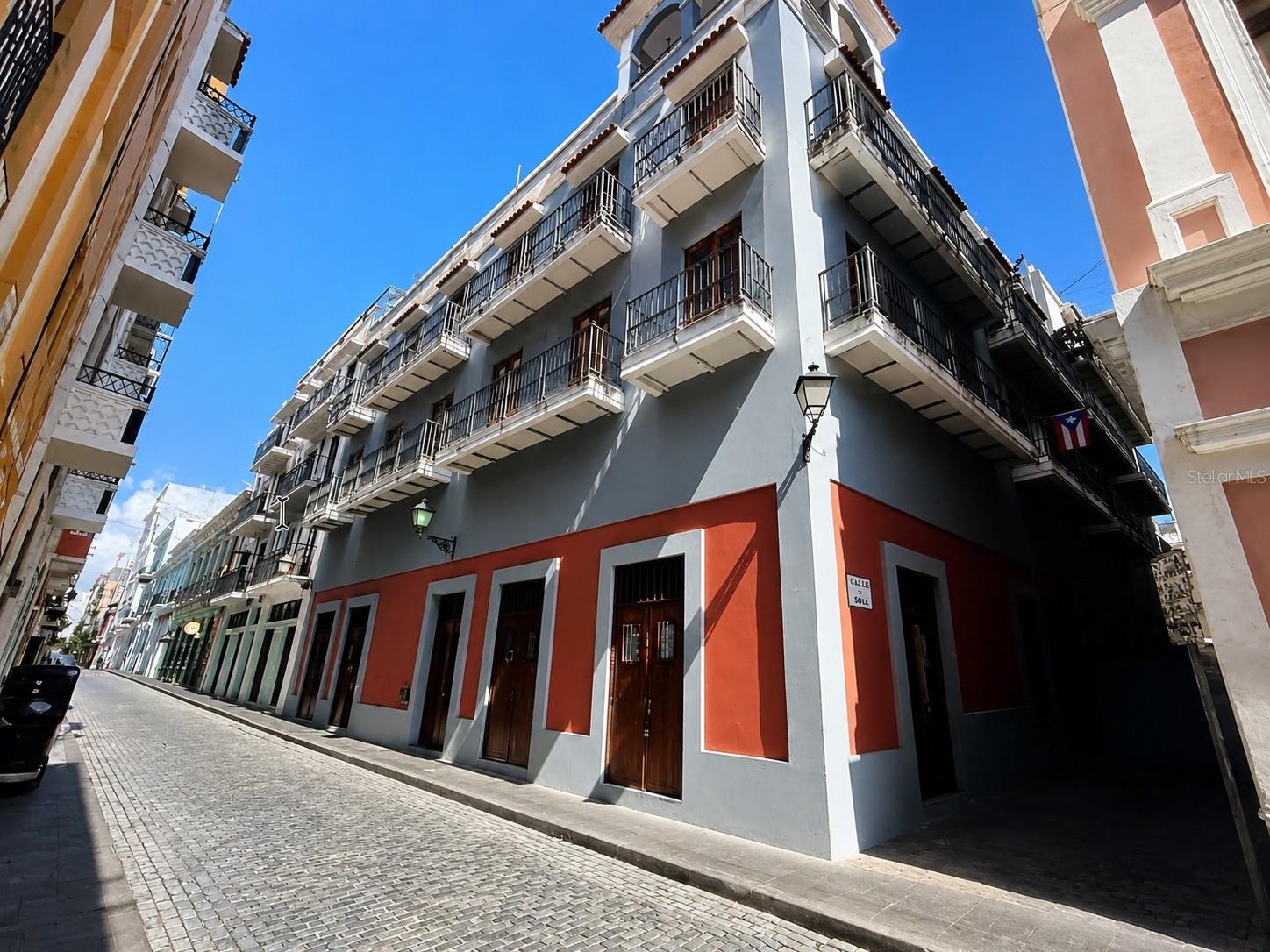 Located on iconic Calle Tetuán in the Gambaro Building, this beautifully designed loft-style apartment offers a rare opportunity to own a home in one of Old San Juan's most desirable locations. Just steps from renowned restaurants, cafés, boutiques, art galleries, and historic landmarks, you'll enjoy the vibrant lifestyle and timeless charm that make this neighborhood truly one of a kind.
The apartment is being sold fully furnished and equipped, featuring a thoughtfully designed open layout, a full kitchen with full-size appliances, a dedicated laundry area, and everything needed to move in and enjoy the property immediately. Every space has been carefully planned to maximize comfort and functionality while maintaining a clean, modern aesthetic.
The Gambaro Building offers exceptional amenities rarely found in Old San Juan, including a full power generator and a water cistern, providing year-round comfort and peace of mind. The monthly HOA fee is $134.73.
Offering 457 square feet of efficiently designed living space, this property is ideal as a primary residence, vacation home, or second home in one of Puerto Rico's most sought-after neighborhoods.
The property is currently tenant-occupied. For buyers seeking an investment opportunity, the current tenant is willing to remain in place under the existing lease. Alternatively, if the buyer intends to occupy the property, the tenant is willing to vacate prior to closing, offering flexibility to accommodate the new owner's plans.