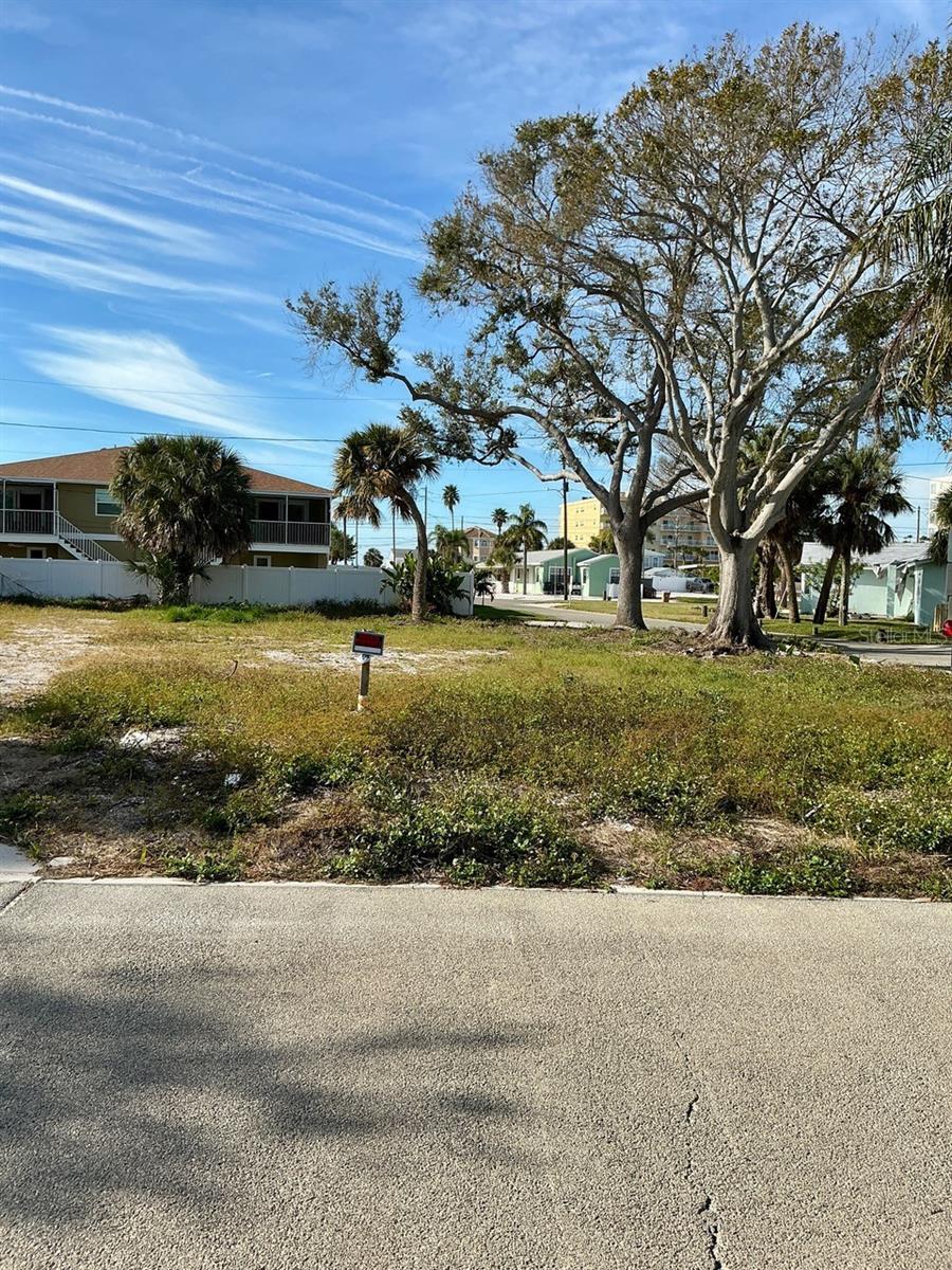 LOCATION, LOCATION, LOCATION!Ready to build your beach house? With lovely shade trees still intact the 4,160 sqft corner lot has been cleared and has utility hookups. This prime location is three minutes to a direct walkway to the beautiful sands of Madeira Beach and the Gulf of Mexico. Ten minutes and you are at the 102 boutiques, bars, and restaurants of John Pass Village. Don’t miss out on this piece of paradise!