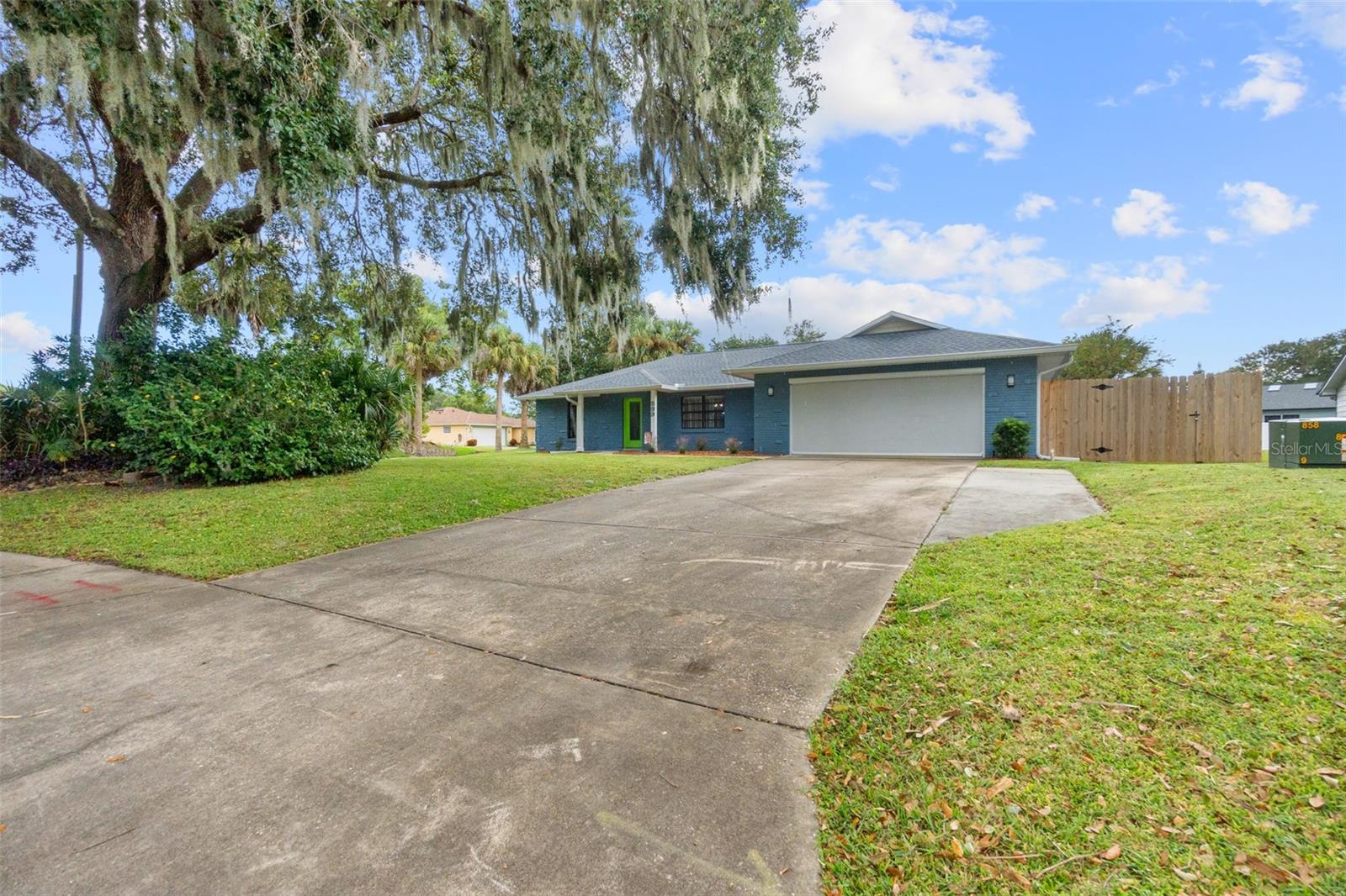 Don't miss this fabulous family home on a beautiful corner lot in a subdivision with NO HOA DUES and AWESOME UPDATES! This 3 bedroom, 2 bath beauty is loaded with lovable updates like a NEW ROOF (2022), skylight, gutters, soffits, garage screen, and fresh exterior paint. Here, your family will enjoy a fabulous open floorplan that's perfect for family living and entertaining with large formal and informal living and dining areas with beautiful tile floors and fresh paint throughout. Enjoy added outdoor living space with a spacious screened Florida room overlooking the large private backyard with lush landscaping and NEW fencing. There’s also great backyard shed with NEW ROOF, paint, and tie-downs offering extra storage for your beach and garden gear. When night falls, the family can settle in with a smile thanks to the 3 spacious bedrooms, 2 beautifully UPDATED baths, and plenty of great closet space. Other great features here include UPDATED laundry room with NEW washer and dryer and all NEW lights, ceiling fans, and window blinds throughout. And your family will love this home’s fantastic central location near great beaches, parks, restaurants, shopping, and entertainment options. This is it. The ONE. Mountains of amazing new memories await your family here. Schedule your showing today!