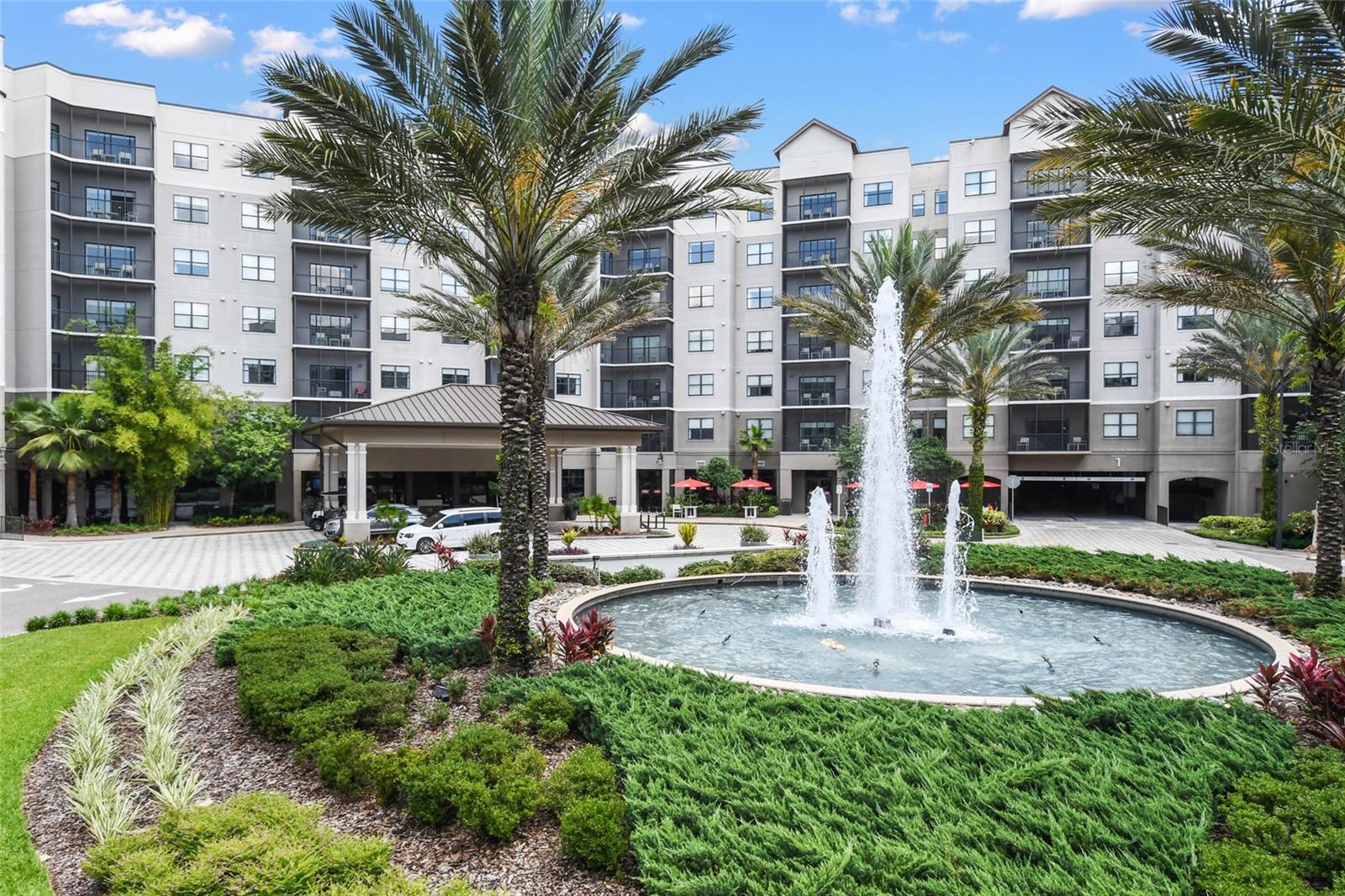 Welcome to the 4-Star rated Grove Resort & Spa Orlando! This high floor, Cypress model corner unit offers a spacious, split bedroom, open layout with over 1,400+ SF of living area. This model features an oversized Primary Suite with separate corner sitting area and guest bedroom features 2 queen size beds. This condo sleeps 8! Other features include a modern interior with solid wood cabinets and solid surface countertops in the kitchen and baths, stainless steel appliances, in-unit laundry room, and all furniture & furnishings included and ready for your turn-key vacation resort. The resort features outstanding amenities including 2 on-site restaurants, spa, fitness center, arcade game room, three pools, private access to Lake Austin, FREE SHUTTLES TO DISNEY PARKS and the on-site SURFARI WATER PARK complete with lazy river, pool-side restaurant and bar, and a FLOWRIDER® double surf simulator. This is a Walt Disney World Good Neighbor® Hotel and less than 5 miles from the world famous Walt Disney World® Resort and Theme Parks. Also, just 3.9 miles to the new Flamingo Crossings Town Center with 40+ shops and restaurants. This amazing condo-hotel unit also offers the convenience of an in-house, on-site hotel rental program which provides rental income when not in your personal use and features a VIP Check-In for condo owners. ALL UTILITIES, CABLE, AND INTERNET INCLUDED IN MONTHLY MAINTENANCE!