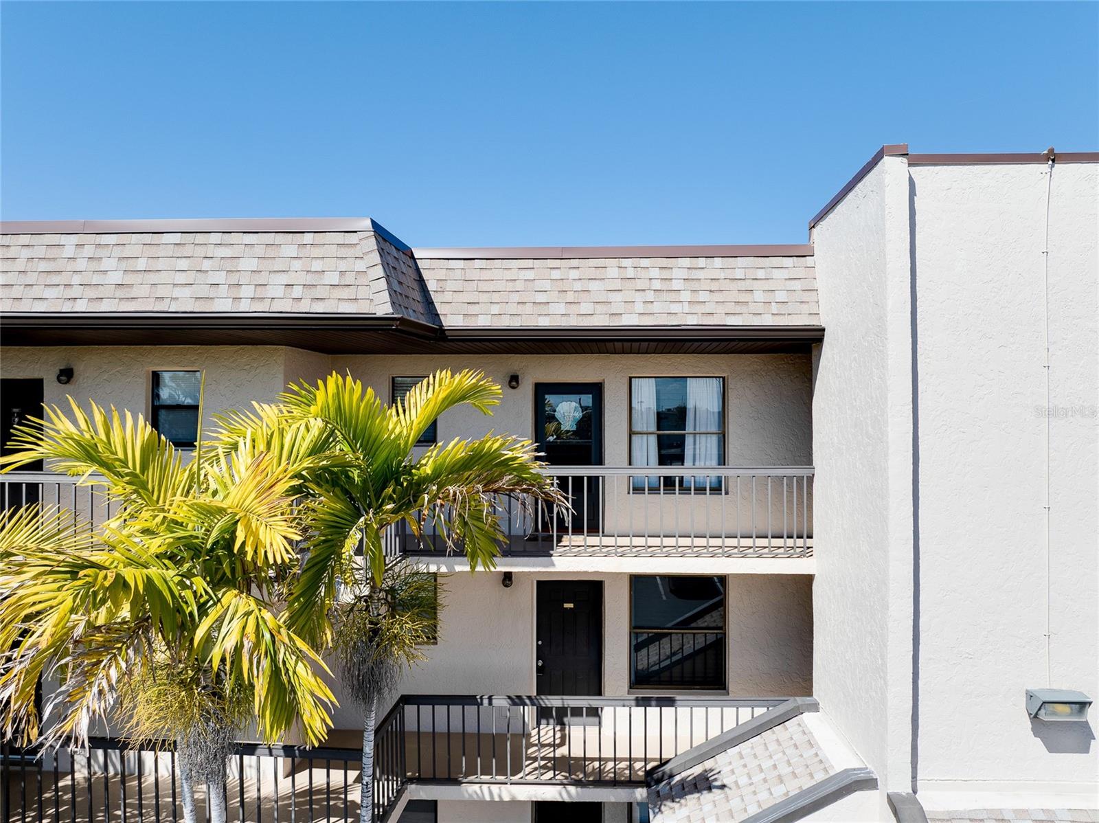Discover easy Florida living at 1999 Kings Highway, Unit 133C, ideally located in the 55+ community of SANDHILL PINES between beautiful Port Charlotte and Punta Gorda. This inviting 2-bedroom, 1-bathroom condo offers a wonderful blend of comfort, functionality, and convenience — and comes FULLY FURNISHED, making it completely MOVE-IN READY. Inside, you’ll find a bright and welcoming living space with tile flooring throughout the main areas, creating a clean and low-maintenance environment.  The kitchen is thoughtfully designed for both everyday living and entertaining. It offers ample cabinet storage, generous counter space for meal preparation, and a convenient breakfast bar that comfortably seats guests for casual dining. The layout allows for easy flow into the main living area, so you can cook while staying connected with family or visitors. Fully equipped and move-in ready, the kitchen provides the ideal space to prepare meals with ease, whether it’s a quick breakfast or a relaxed evening dinner at home. Both the primary bedroom and second bedroom are perfectly set up and ready for you and your friends to settle in after a long day at the beach. As an added bonus, this unit has a COMBO WASHER and DRYER conveniently located IN THE UNIT. Recent updates include the A/C and HOT WATER HEATER were both replaced in 2021. Step outside to your PRIVATE BALCONY and enjoy peaceful views overlooking the community pool and tennis courts — an ideal setting to sip your morning coffee or unwind at the end of the day. Situated in a well-maintained ELEVATOR building for added comfort and accessibility, this unit offers everyday convenience. Just minutes from shopping, dining, entertainment, medical facilities, and major roadways, you’ll love how close you are to everything Port Charlotte and charming Punta Gorda have to offer. Perfect as a primary residence or a seasonal getaway, this home is ready for you to move in and start enjoying the Florida lifestyle right away. Don't miss out on this fantastic deal today!