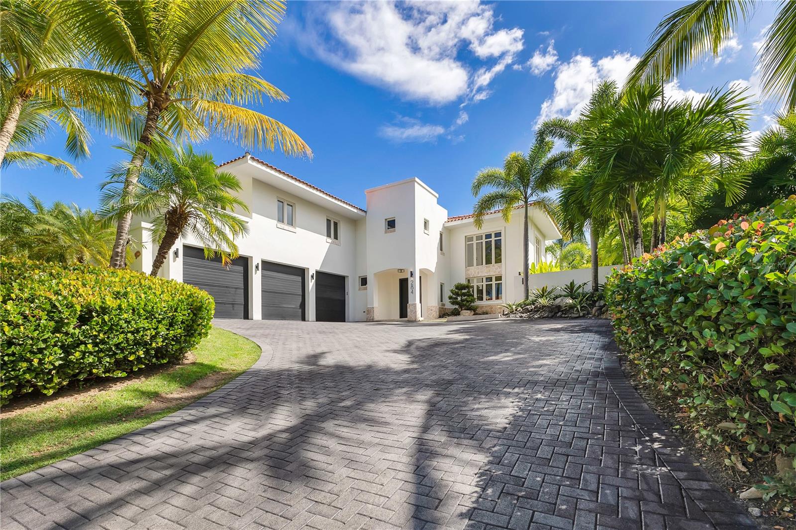 Beautiful property located in Dorado Beach East community, this stunning 6,555 total square-foot residence providing the perfect blend of luxury, comfort, and functionality. Boasting four spacious bedrooms all ensuite, seven beautifully appointed bathrooms, and a versatile flex room, this home is designed to accommodate a variety of lifestyles. Additionally, a separate designated apartment provides an ideal private retreat for guests, complete with a full bathroom, living space, and a well-equipped kitchenette that is thoughtfully designed with a GE side-by-side refrigerator, gas range, and microwave, offering both convenience and style. The heart of the home is the impeccably designed main kitchen, featuring a 48” GE Monogram all-gas professional range with a sleek wall-mount pot filler, a custom brass hood with integrated ventilation and lighting, and top-tier appliances, including GE Monogram 36” refrigerator and freezer columns, under-counter double drawer refrigerators, an ice maker, a fully integrated dishwasher, and a drawer microwave. Wine enthusiasts will appreciate the two Thermador wine columns, ensuring the perfect temperature for every bottle. Each main bathroom is equipped with premium Kohler appliances and accessories, while the master suite's spa-like retreat is adorned with Restoration Hardware finishes, delivering an unmatched level of sophistication and relaxation. Stepping outdoors, you'll find a beautifully landscaped oasis featuring a sparkling pool. The property is surrounded by mature, lush landscaping that enhances privacy and provides a serene tropical ambiance. A fully air-conditioned pool house completes the outdoor retreat, offering a comfortable and stylish space to entertain or unwind. With its elegant design, state-of-the-art features, and prime location within Dorado Beach East, this exceptional home presents an opportunity to experience the ultimate luxury living.