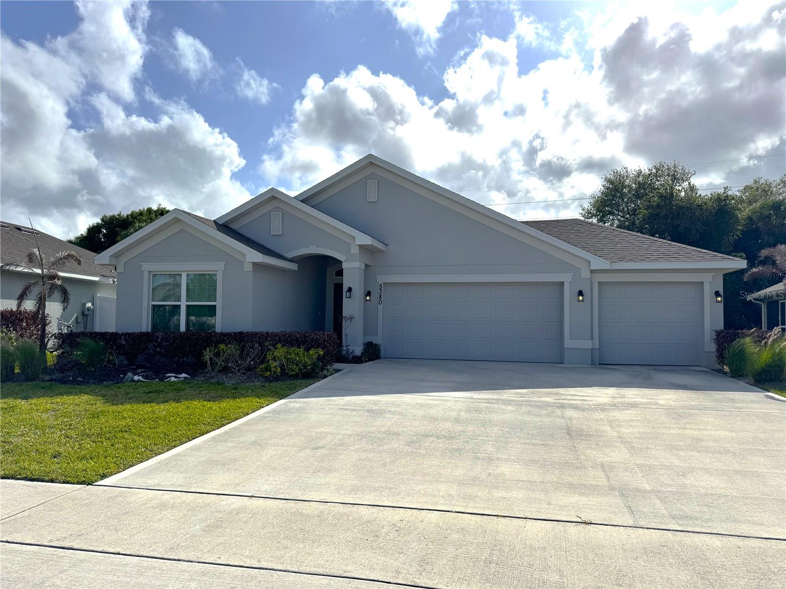 Only minutes away from the beach! Built in 2021, this beautiful single-story home offers 3 bedrooms and 2 bathrooms with a modern open-concept layout designed for comfortable living and entertaining. The spacious kitchen flows seamlessly into the living and dining areas, creating a bright and inviting atmosphere. The primary suite features a generous walk-in closet, while the covered lanai provides the perfect space to relax or enjoy outdoor gatherings. A standout feature is the oversized 3-car garage, offering plenty of room for vehicles, storage, or a workshop. Conveniently located in Fort Pierce near shopping, dining, and major roadways—this home is a must-see!