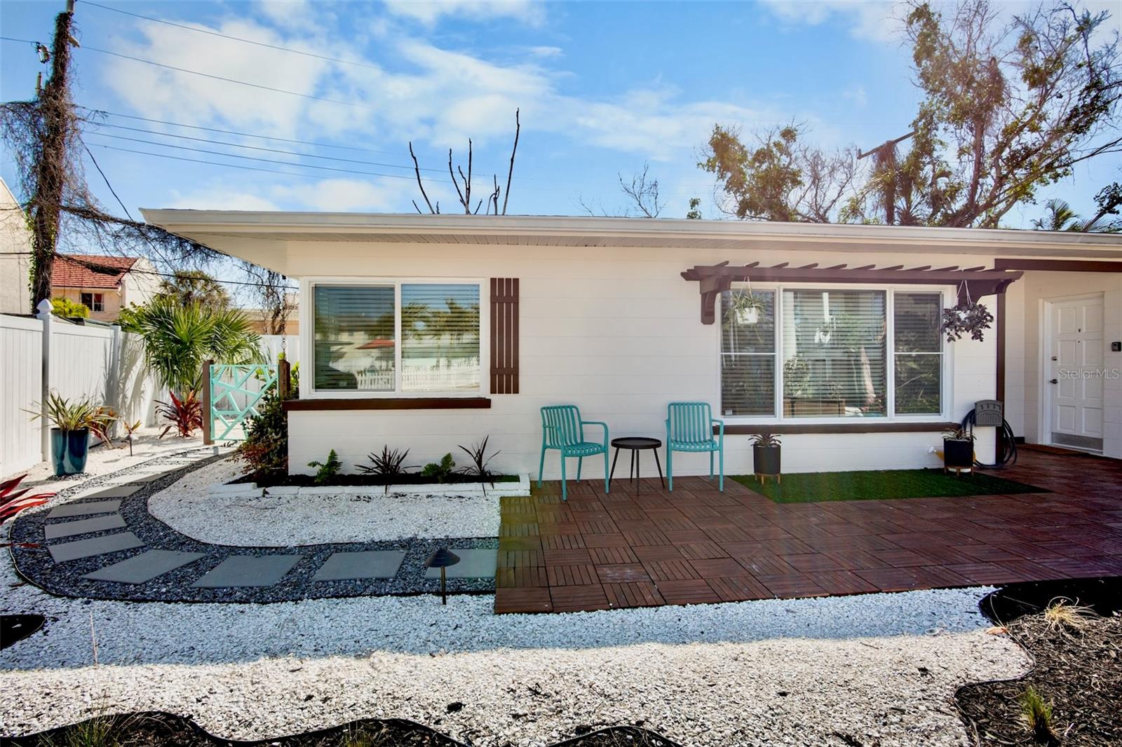 Rare opportunity on Siesta Key to own a fully remodeled multifamily property just moments from world-famous Siesta Key Beach. Offering two separate residences, each featuring 2 bedrooms and 1 bathroom, this property presents flexible potential for personal use, short-term rental income, or a live-in investment opportunity. Both units have been extensively updated throughout, featuring luxury vinyl plank flooring, updated electrical and plumbing, fresh interior finishes, new interior doors, and bright coastal-inspired design elements. The kitchens showcase white shaker cabinetry, quartz countertops, stainless steel appliances, and striking teal subway tile backsplashes that bring a fun yet refined coastal character to the space. Open living areas are filled with natural light from oversized windows and complemented by custom wood accent detailing. Each residence includes remodeled bathrooms, private entrances, and in-unit stacked washers and dryers for convenience. Outside, the property offers exceptional curb appeal with tropical landscaping, decorative stone accents, paver courtyard spaces, pergola detailing, and a charming gated entry. Residents and guests can also enjoy access to a nearby community pool. What’s special: guests enjoy private gated beach access through the club, with lounge chairs and umbrellas provided for effortless days on the sand. Located in one of Siesta Key’s most desirable beachside areas, this move-in-ready property offers a rare combination of style, flexibility, and investment potential in an unbeatable location.