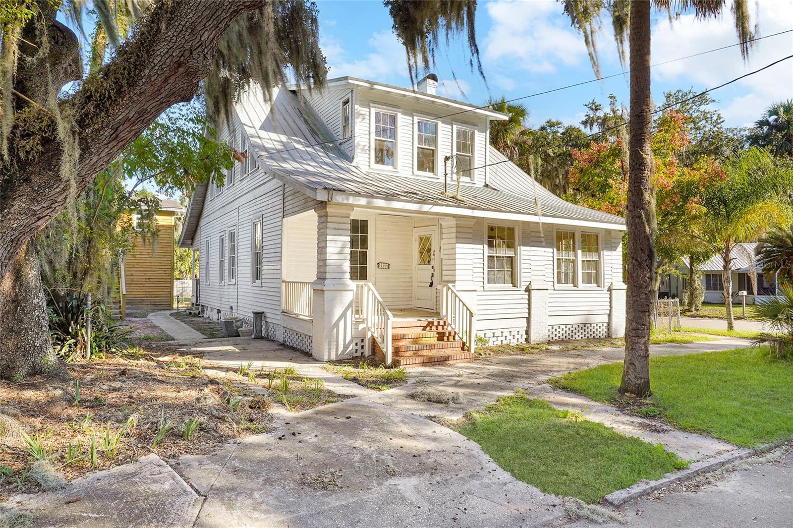 Handyman special centrally located in the beautiful South Historic District of downtown Palatka! This charming house needs restoration but has 4 bedrooms, and 2.5 baths with over 2100 square feet. Originally built in 1884 the home features wood floors throughout, lots of built-ins, large bedrooms, 2 fireplaces, front porch for taking in the daily passerby's, an additional detached 2 story storage house for all your toys, and views of the St. Johns River from the backyard. The location is perfect, just two blocks to St. Johns Ave. for all your dining and shopping needs or walk two blocks to Boathouse Riverfront Park and take a stroll along the river. Enjoy area parks, boat ramps, and laid-back North Florida living in Putnam County or head to St. Augustine for day at the beach. Grab your tools and / or your favorite general contractor and take advantage of this amazing opportunity today!!!
