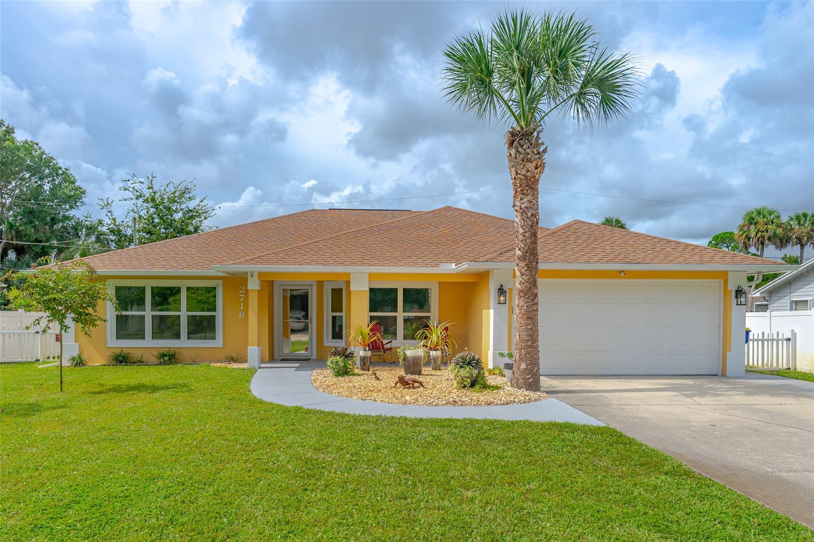 MOVE IN READY! This 3 bed/2bath home with an open floor plan has it all: new tinted impact windows throughout, stunning neutral wood-look tile in the living areas and kitchen, new gutters, new AC, new water heater, 8 camera exterior security system, and a whole-house generator! The large fenced backyard is perfect for summer BBQ's and offers plenty of room for a swimming pool. Enjoy your morning coffee or evening cocktails on the large screened lanai. 
Conveniently located close to the river, beaches, local eateries, grocery store and I-95. This home won't last long, so schedule your private showing today!

All measurements are approximate and should be verified by buyer. ;Water: City