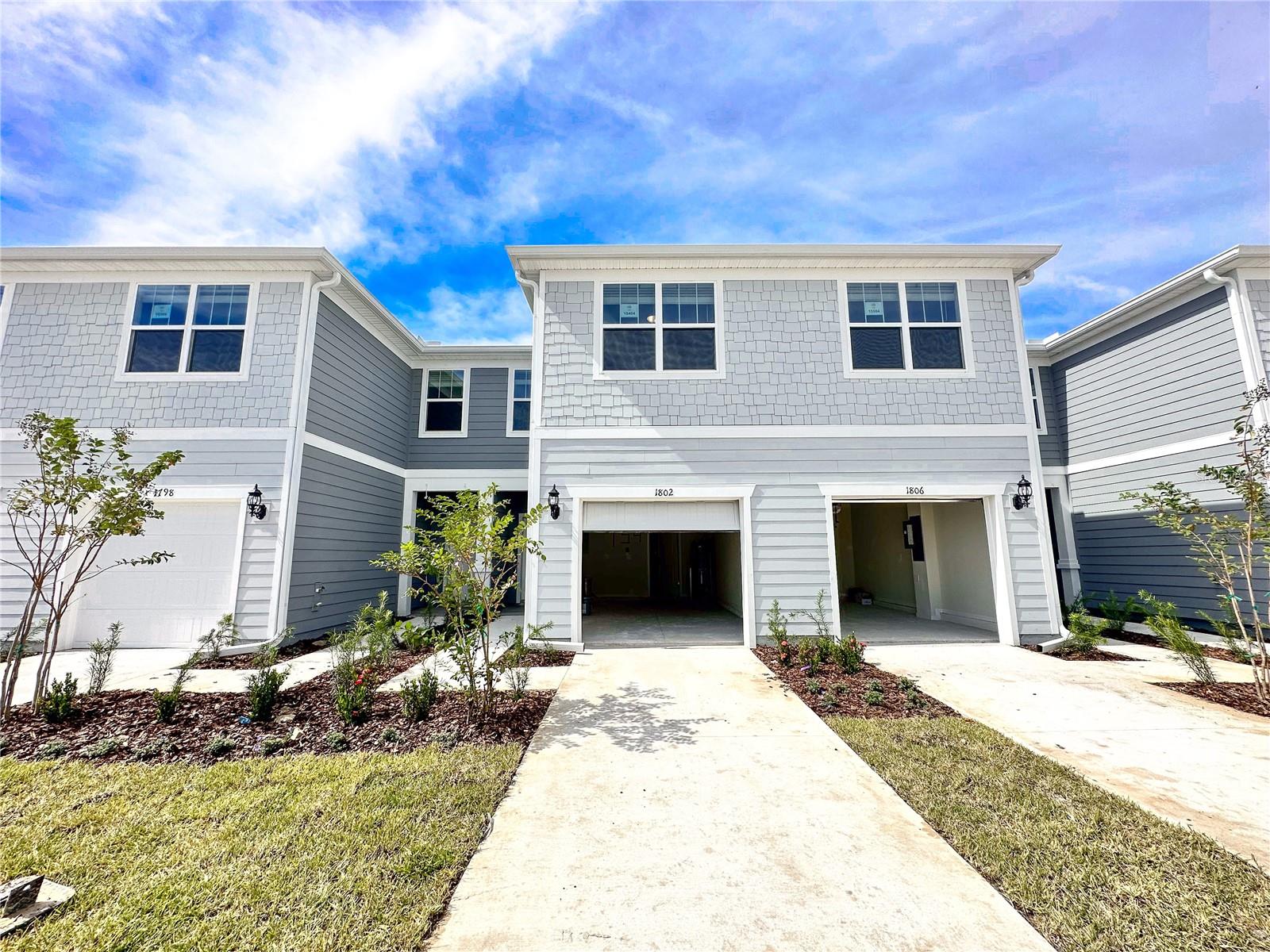 Be the very first to enjoy this brand-new home! This gorgeous two-story townhome offers 3 bedrooms, 2 full bathrooms, a powder room, a single-car garage, a delightful back patio, and comes complete with washer, dryer, refrigerator, and blinds. It features a stunning open green field view with no rear neighbors, a short walk to the amenity center, and comes equipped with all the essentials you need!

The spacious first floor is designed for entertaining, featuring an open concept gathering room that seamlessly connects to the modern eat-in kitchen, as well as a handy powder room.

Upstairs, the owner's suite offers a generously sized walk-in closet and a suite bathroom with a double sink quartz-topped vanity and a spacious shower. Two additional bedrooms, the secondary bathroom, and the laundry area are thoughtfully located on the opposite side of the second floor, providing privacy and ample space for everyone.

Belle Haven enjoys a prime location just minutes from Hwy-27, I-4, SR-429, Disney, and the vibrant 80-acre open-air shopping, dining, and entertainment center of Posner Park. On-site amenities include a community pool with a cabana, open green spaces, and a community playground. Rent includes Spectrum Gigabit High-speed Internet and TV!