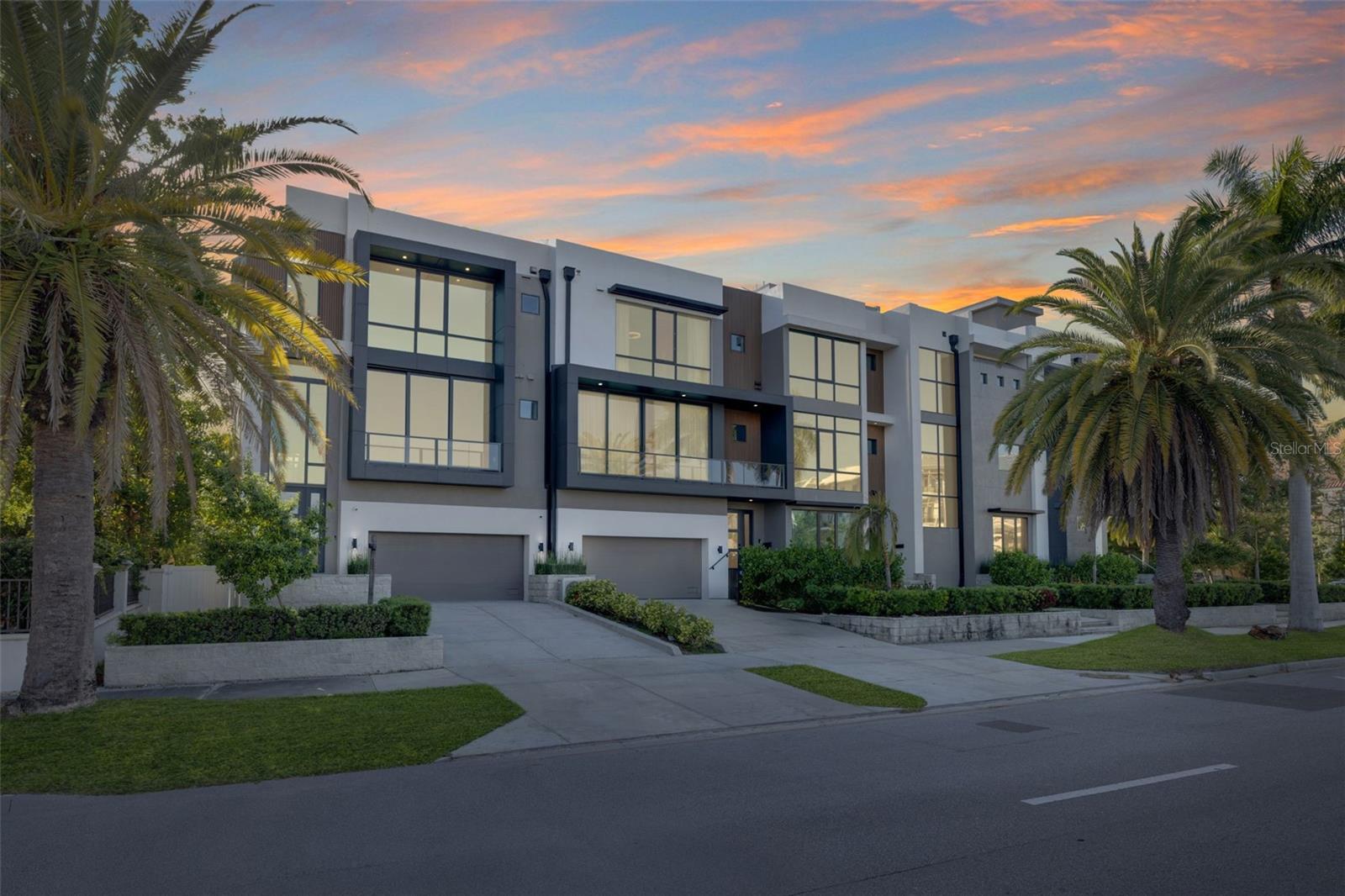 Short Sale. Third-Party Approval Required. Welcome to 98 W Davis Blvd, an exquisite luxury townhouse nestled in the heart of prestigious Davis Islands in Tampa, Florida. Built in 2022, this exceptional residence exemplifies modern sophistication and convenience, serving as the final masterpiece of acclaimed designer Tommy Lamb. From its meticulously curated details to its thoughtfully designed layout, every element of this home reflects the pinnacle of high-end living. Upon entry, the first floor reveals a versatile bonus room complete with a wet bar—an ideal space for entertaining guests. Adjacent to this is a spacious guest suite featuring an en-suite bathroom with custom built-ins, a dedicated makeup vanity, and direct access for use as a pool bath. The second floor is designed for both elegance and functionality, offering a formal living room with a sleek ventless fireplace, a sophisticated dining area, a powder bath, and a chef-inspired kitchen. Outfitted with top-of-the-line Wolf appliances, a Sub-Zero refrigerator, and a stunning waterfall island that comfortably seats four, the kitchen is further enhanced by a striking quartz feature wall, dual pantries, and abundant cabinetry. Nearby, a cozy family room and a glass-enclosed wine room—showcasing the floating staircase—complete the floor. Ascend to the third level where you’ll find another guest suite with a walk-in closet, a dedicated laundry room with dual washer and dryer sets, and a breathtaking master suite. The master retreat features a private balcony, an expansive walk-in closet with sleek black built-ins and gold accents, and a spa-inspired en-suite bathroom. Indulge in the freestanding black soaking tub, oversized shower with multiple heads, and dual vanities designed for both function and flair. For added ease, an elevator services all levels of the home. The two-car garage offers generous space, including room for a golf cart. Retreat to your own private rooftop where you can soak up the beautiful Florida sunsets and enjoy water views perfect for both intimate relaxation and vibrant entertaining. Located on the coveted Davis Islands, this property provides not only a refined lifestyle but also a family-friendly environment. Residents enjoy access to top-rated A+ schools and a vibrant, picturesque community just moments from downtown Tampa. Don’t miss the rare opportunity to own this extraordinary residence. Bring an offer!!