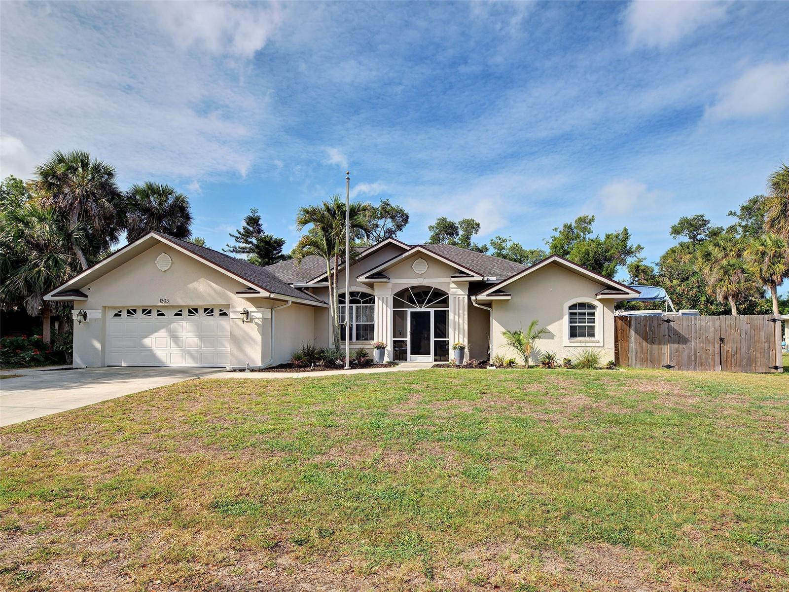 Welcome to your private Florida retreat in Venice! This beautifully maintained 3-bedroom, 2-bath home offers the perfect blend of comfort, space, and location. Nestled on a peaceful creek with a lushly landscaped backyard, you'll enjoy serene views, a fire pit gathering area, boat storage, and a shed—your own outdoor paradise. Inside, the open floor plan is designed for easy living and entertaining, featuring soaring cathedral ceilings, a spacious dining room, and a warm family room with a wood burning fireplace that is plumbed for LP. The separate living room is currently used as a home office, offering flexibility for today's lifestyle. A built-in bar area adds the perfect touch for hosting guests. The kitchen opens to the family room and features raised panel cabinetry, a convenient bank of drawers, breakfast bar, built-in oven, cooktop, new faucet and all new stainless steel appliances installed in 2026. The spacious primary suite is a true retreat with tray ceiling, two oversized walk-in closets, and an ensuite bath with dual sinks, garden tub, separate shower new commode and faucets.  A split-bedroom layout provides privacy, with two guest bedrooms sharing a full bath also with new commode and faucet. Additional highlights include a built-in floor safe, laundry room with sink, oversized 22' x 24' garage with attic storage and expansive driveway. This home comes fully equipped with an emergency generator subpanel.  A new roof in 2023, and A/C replaced in 2020.  House is pre-plumbed for water softener or whole home water filtration system. A newer home with underground utilities located within an established neighborhood, this property offers even more value with no HOA, no CDD fees, and no Flood Zone! Directly across the street, enjoy a neighborhood park with slides, swings, monkey bars, merry-go-round, and picnic area. Just minutes from charming downtown Venice, where you'll discover boutique style shopping, dining, performing arts theaters, parks, splash pad, boat launches, and stunning Gulf-front beaches. This is Florida living at its finest!
