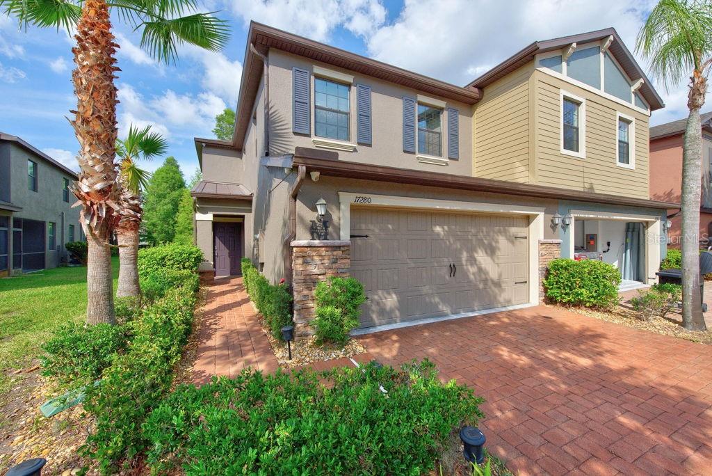 Natural light pours into this immaculately maintained 3-bedroom, 2.5-bath end-unit townhome, offering 1,799 square feet of thoughtfully upgraded living space within a desirable gated community. With additional windows exclusive to an end unit, the home feels bright, open, and inviting throughout. The spacious interior has been enhanced with durable wood laminate flooring replacing the carpet on the stairs and throughout the second floor, creating a warm, modern look with easy maintenance. The versatile guest bedroom features a custom-built Murphy bed, providing the flexibility to function as both a comfortable bedroom and productive home office. Designed with convenience and comfort in mind, the home includes a water softener system and reverse osmosis drinking water system in the kitchen. Additional upgrades such as overhead garage storage racks maximize organization, while rear gutters and automatic remote-controlled shades on the lanai add both functionality and everyday ease. Whether you're relaxing indoors, enjoying the private outdoor space, or taking advantage of the community amenities, this move-in-ready townhome offers the perfect blend of style, practicality, and low-maintenance living in a secure gated setting. ***FREE 1/0 Rate Buydown when using the seller's preferred lender!***