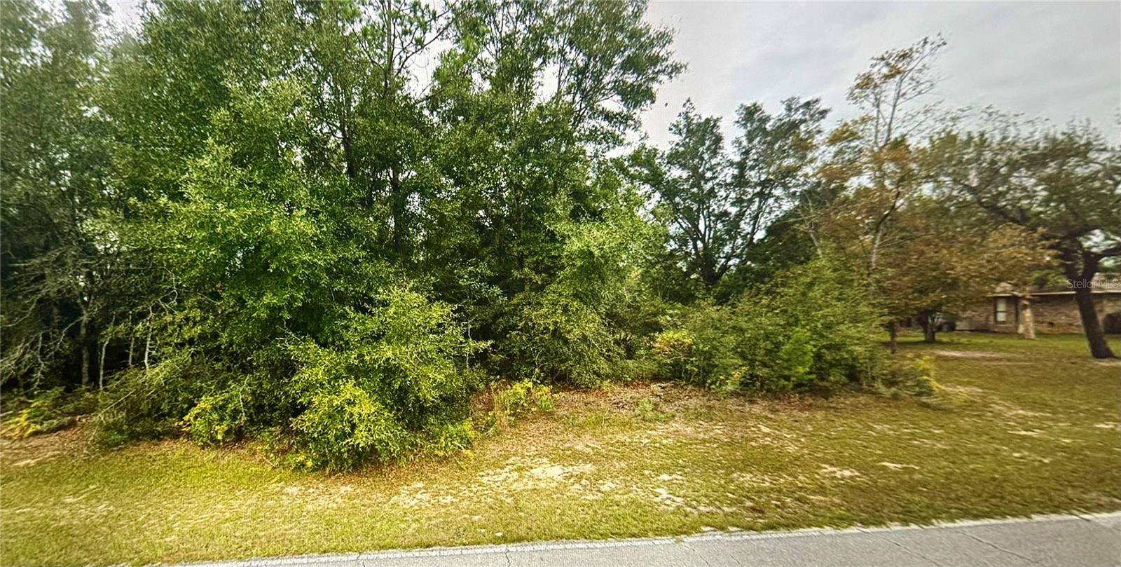 OWNER FINANCING AVAILABLE. Build in the growing Sunny Hills community! This residential homesite is located on a paved road just steps from newer construction. Enjoy a peaceful setting with easy access to the renowned Sunny Hills Golf Club, scenic lakes, parks, and outdoor recreation. Conveniently located approximately 30 miles north of Panama City and the Gulf Coast beaches, with quick access to Highway 77. No required timeframe to build, making it an excellent opportunity for homeowners, builders, or investors. Buyer to verify all property details, utilities, zoning, setbacks, and building requirements.