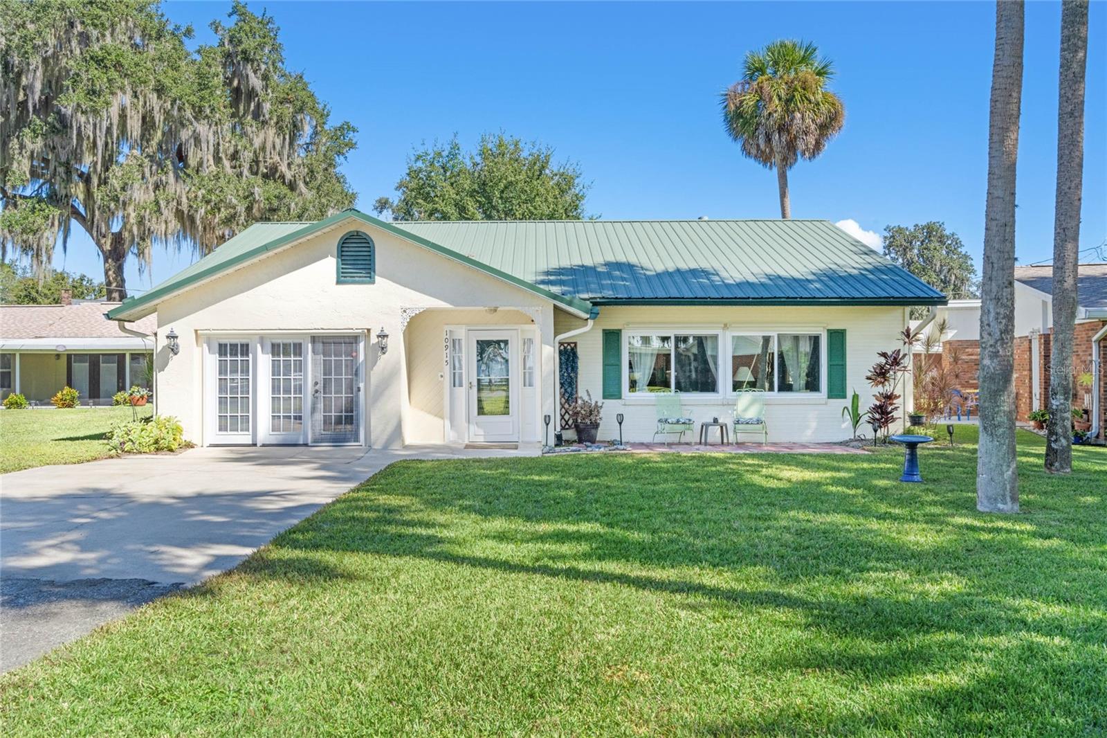 Take a look at this 2/2 block home located in a small waterfront community on Lake Harris. The private community dock, deeded boat slip, marina, picnic area, beach and private park are all included.  The HOA fee includes all private water supply and irrigation to the Rod ‘N Reel community which is a cost savings to the homeowner. One of the best features is that Lake Harris can be seen from your front yard. If you prefer sitting on your own covered wooden deck in your backyard there is a view of the canal. Two storage sheds providing plenty of room for gardening tools as well. The house has many possibilities for either a snowbird or someone looking to live here permanently. There is an additional office/den and plenty of closets for storage. The 2nd bedroom being used was a 2-car garage conversion from a previous owner. A metal roof was installed in 2006 and A/C in 2014.  Refrigerator 2021, microwave new October 2023, stove and dishwasher are approximately 6 years old. New SunSetter remote control shades over the front windows. Plus, the owners are offering a one year Home Warranty.  Come see for yourself what it could be living close to Lake Harris and enjoying the lifestyle of boating and fishing.