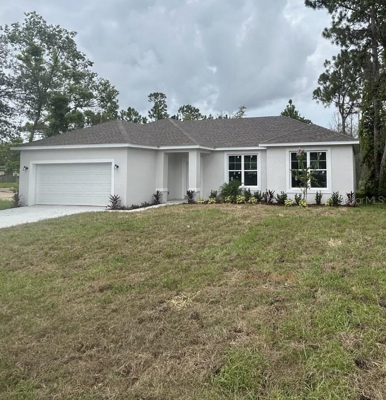 Under Construction. NEW BUILD!! NOW is YOUR time!! This beautiful new home is located in a quiet neighborhood with no HOA fees! Perfectly nestled on a quiet street, you'll be wanting to call this 1,458 square foot, 3/2 split floor plan "Home Sweet Home!" The main living area is open to the kitchen and boasts soaring ceilings that provide a spacious, open feel. The gorgeous kitchen includes stainless-steel appliances, 42” cabinets and a granite-topped island. The Owner’s Suite features a large walk-in closet and the private bathroom includes a step-in shower with custom tile and a large corner soaking tub. Additional features include ceiling fans in all bedrooms and living area. Don’t miss this incredible opportunity! SCHEDULE A SHOWING TODAY!!