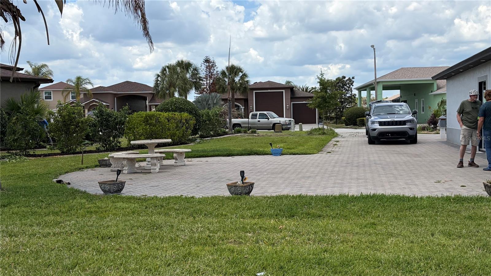 Discover this charming 1-bedroom, 1-bathroom gem nestled in the highly desirable MT OLIVE SHORES community—an area known for its peaceful setting, friendly neighbors, and sought-after RV-lifestyle amenities. This well-maintained home delivers comfort, convenience, and the perfect blend of indoor and outdoor living. Step inside to an inviting layout featuring a bright, open living area seamlessly connected to the kitchen through a classic serving window, ideal for entertaining or effortless everyday flow. The kitchen offers excellent functionality with plenty of room to personalize. Outside, this property truly shines with multiple outdoor living options—a fully enclosed patio for year-round enjoyment plus a screened-in patio perfect for morning coffee, evening relaxation, or hosting guests. Parking and storage are a breeze with both a 1-car garage and a 1-car carport, offering flexibility for vehicles, hobbies, or seasonal items. Homes in this community are in high demand—don’t miss your chance to secure this fanta