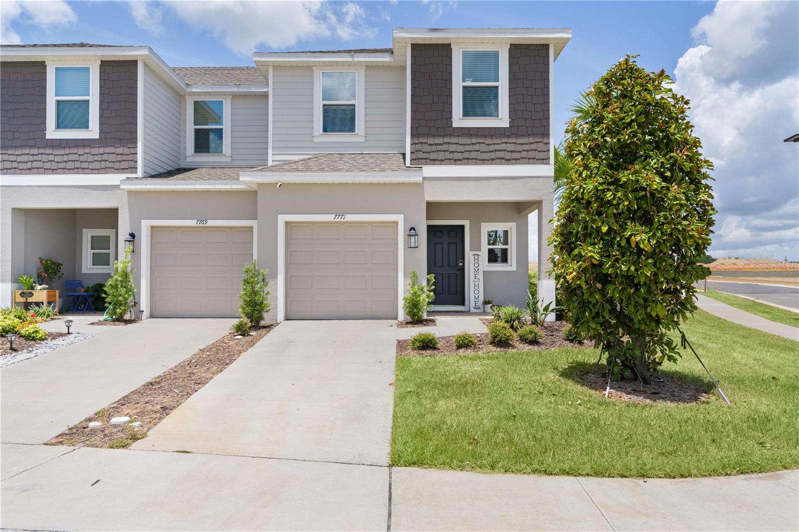 MOVE-IN Ready with a 5.5 assumable interest rate. Don’t wait months for new construction. This end-unit townhome is upgraded and ready for you to TODAY! Perfectly positioned on a corner lot as the end unit of the building, this residence offers a combination of privacy, natural light, modern finishes, and low-maintenance living that is difficult to find in today's market. From the moment you arrive, you'll notice the home's attractive curb appeal, enhanced sense of space, and premium location. Unlike interior units, this end-unit townhome enjoys additional windows, creating a bright, airy, and inviting atmosphere throughout. The corner-lot placement provides extra green space, increased privacy, and additional parking, making this one of the most sought-after homes within the neighborhood. Step inside to discover a beautifully maintained interior showcasing a clean, contemporary design with numerous upgrades already completed for the next owner. Soaring 9’ 4” ceilings creates a sense of openness with tile flooring throughout the main living areas provides elegance and durability. The kitchen serves as the heart of the home and features stylish cabinetry with updated hardware, modern fixtures, upgraded faucet, and designer-inspired finishes that elevate the space. Whether preparing meals, hosting guests, or enjoying a quiet morning coffee, the kitchen flows effortlessly into the main living and dining areas. Throughout the home, you'll find newly installed ceiling fans, upgraded hardware, and carefully selected details that new construction doesn’t. A generously sized storage closet beneath the stairs offers additional storage space. Every detail has been completed, allowing the new owners to enjoy the home without the added expense and inconvenience of post-closing upgrades. One of the best advantages of this property is its immediate availability. Unlike builder inventory that requires months of construction, permitting delays, and upgraded expenses, this residence is ready for immediate occupancy! Many of the new-construction punch-list items and warranty concerns have already been addressed, offering peace of mind and a smooth transition for the next homeowner. Additional highlights include a one-car garage, internet and lawn maintenance included in the HOA dues, providing a truly convenient and low-maintenance lifestyle. Beyond the home itself, residents enjoy a vibrant community with exciting amenities planned to further enhance the neighborhood experience. Upcoming additions are expected to include a second pool with cabana, a dog park, a nature-inspired playscape, creating added opportunities for relaxation and outdoor enjoyment. For buyers considering new construction, this home presents an outstanding value proposition. With its premium end-unit location, corner-lot setting, completed upgrades, maintenance-free lifestyle, immediate availability, and potential assumable financing opportunity, it offers benefits that are increasingly difficult to replicate through current builder inventory. Location is where this home truly shines. Just minutes from downtown Groveland and Clermont, local restaurants, breweries, coffee shops, and the South Lake Trail with connectivity to Winter Garden. Convenient access to the Florida Turnpike, Walt Disney World, and Orlando International Airport all within approximately 50 minutes, this home delivers the perfect blend of comfort, efficiency, and location. Schedule your private showing today!