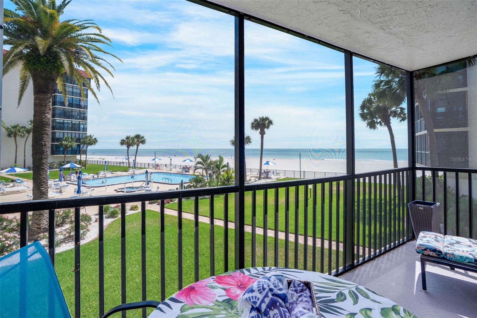 Experience the best of Gulf-front living in this beautifully maintained second-floor residence at Shore Mariner-- a premier 55+ beachfront community in Redington Shores. Perfectly positioned to capture sweeping, unobstructed views of the turquoise Gulf waters and cool quartz sandy beaches, this fully furnished home offers the coastal lifestyle buyers are seeking. Wake up to breathtaking views and unwind to the sound of the waves and gorgeous sunsets from your private screened balcony overlooking the Gulf! Inside, the spacious floor plan is thoughtfully designed for both comfort and privacy, featuring oversized bedrooms; perfect for entertaining guests or hosting visitors! The upgraded kitchen shines with custom cabinetry, light quartz countertops, deep sink, and matching LG appliances— seamlessly opening to the living space with views of the water from the kitchen. All new vinyl flooring throughout the residence provides a fresh, modern, and cohesive feel. BONUS features include: a whole-home water filtration system, WASHER and DRYER in unit, and $17,000 in new hurricane impact-rated sliding glass doors. Residents enjoy an active, resort-style lifestyle with amenities including a massive heated Gulf-front pool and spa, fitness center, and a vibrant social calendar. This low-maintenance community also offers a deeded carport space, private storage, and a welcoming atmosphere. Whether you’re looking for a full-time residence or a coastal retreat, this waterfront opportunity delivers exceptional views, high-quality upgrades, and outstanding value in one of the area’s most desirable beachfront communities.